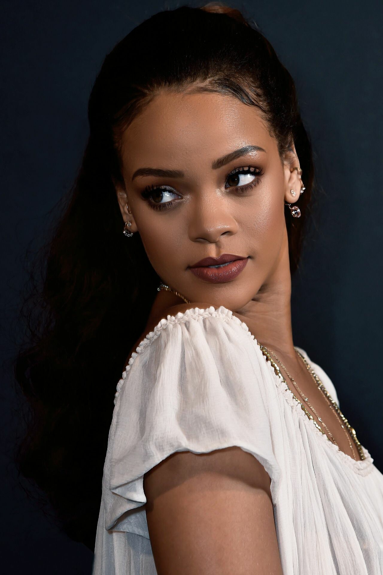 Rihanna: Broke into the recording industry in 2005 with the release of her debut album, Music of the Sun. 1280x1920 HD Background.