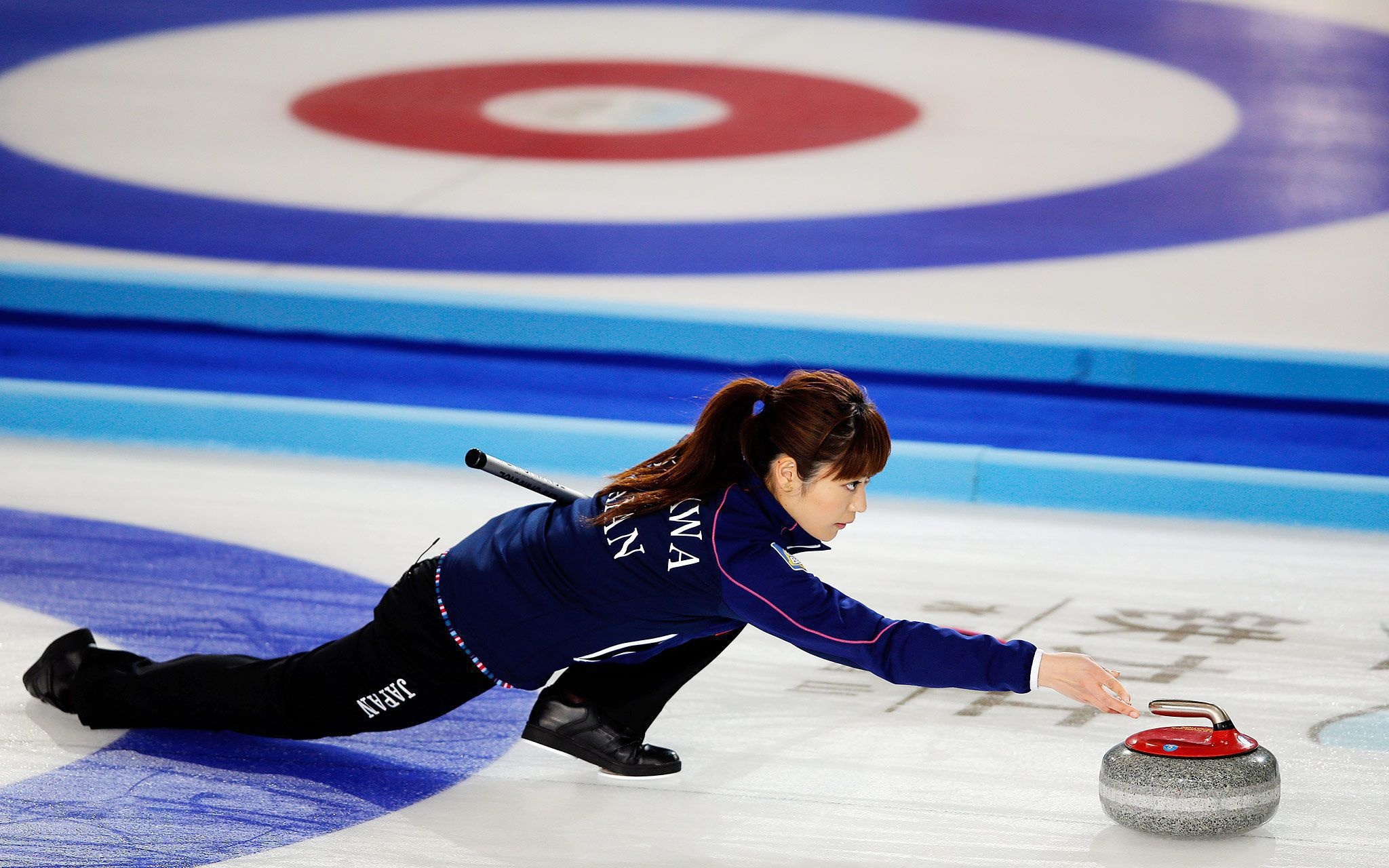 Curling: A Japanese professional female curler, A competitive winter sport. 2050x1280 HD Background.