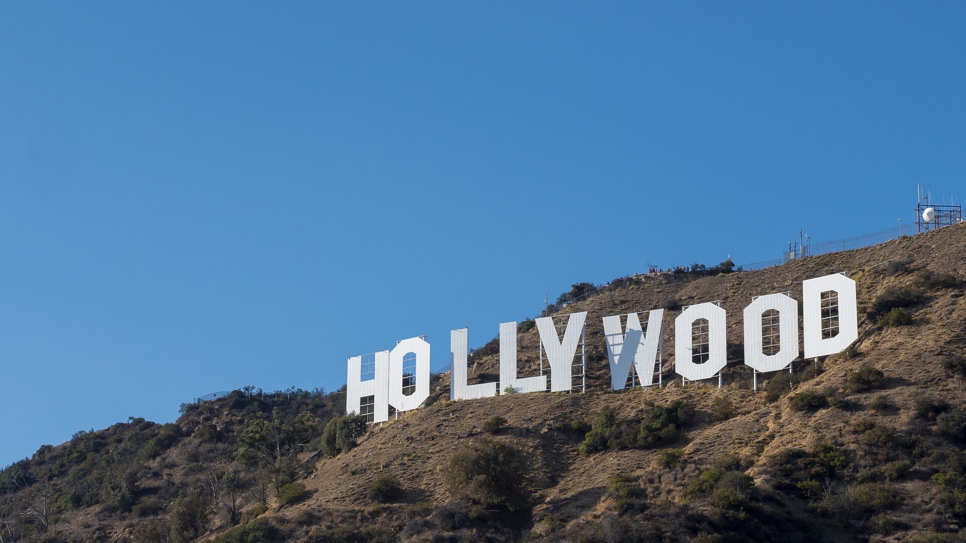 Hollywood Sign: The original landmark was erected in 1923 to promote the name of a new housing development in Los Angeles. 1920x1080 Full HD Background.