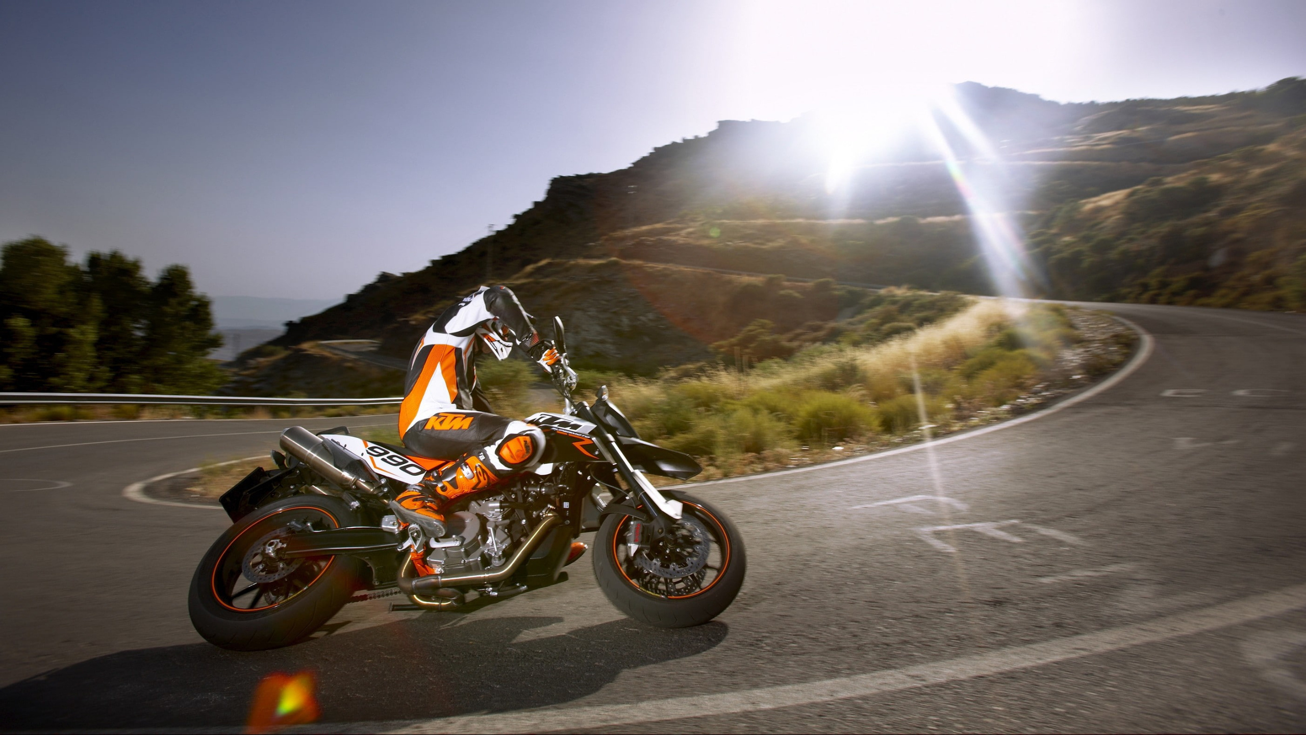 Supermoto: The KTM 990 SM R, A stunning motorcycle, A thrilling ride, A water-cooled V-engine. 2560x1440 HD Background.