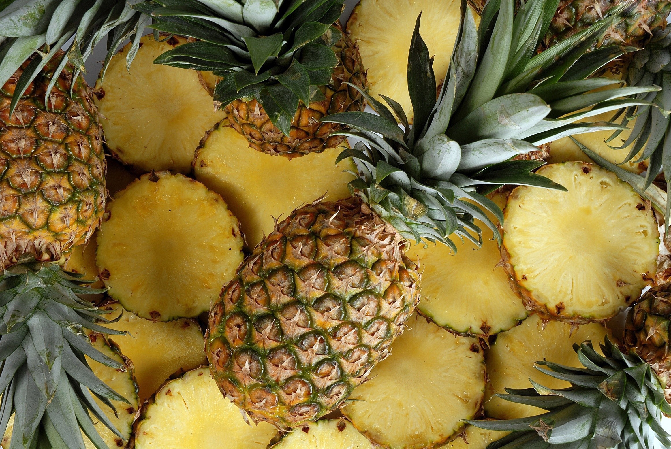 Pineapple: A perennial plant of the family Bromeliaceae and its edible fruit. 2330x1560 HD Background.