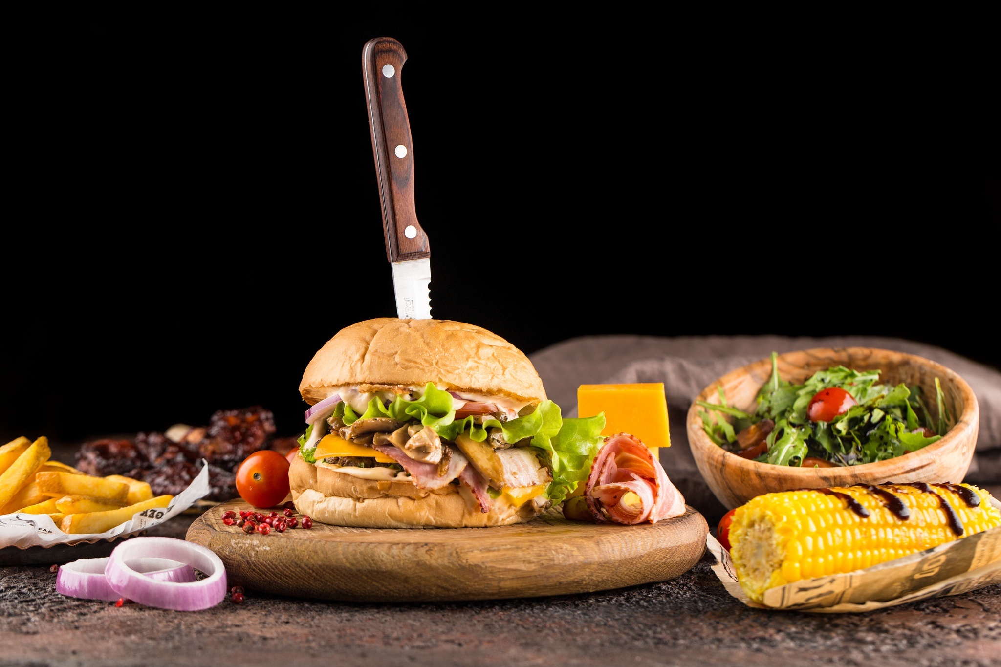 Hamburger: Corn. Onions, Salad, Cheese, Chips, Barbecue, Sandwich. 2050x1370 HD Background.