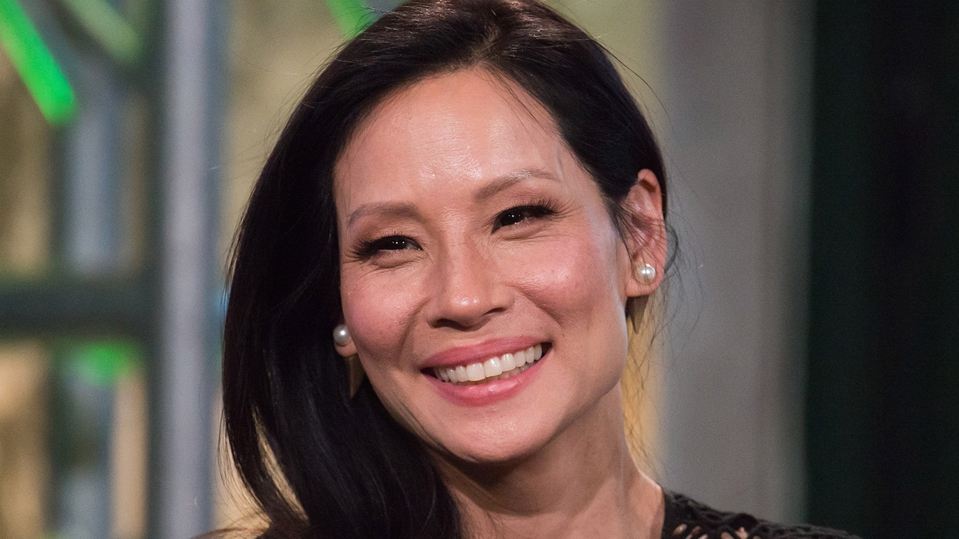 Lucy Liu: An American actress and director who has appeared in Hollywood TV and film classics since the 1990s. 1920x1080 Full HD Background.