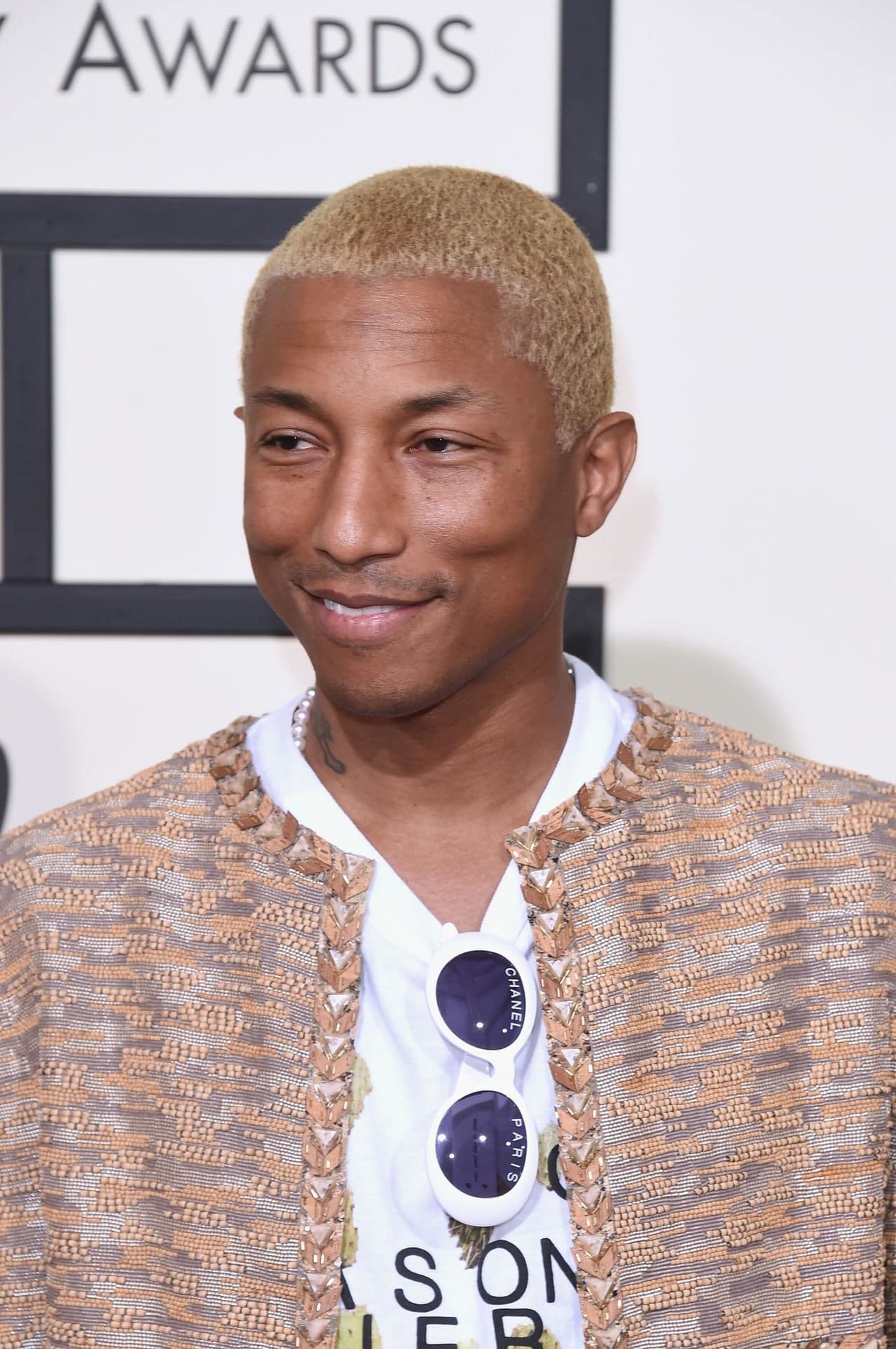 Pharrell Williams, Fashion icon, Music maestro, Candid moments, 1280x1930 HD Phone