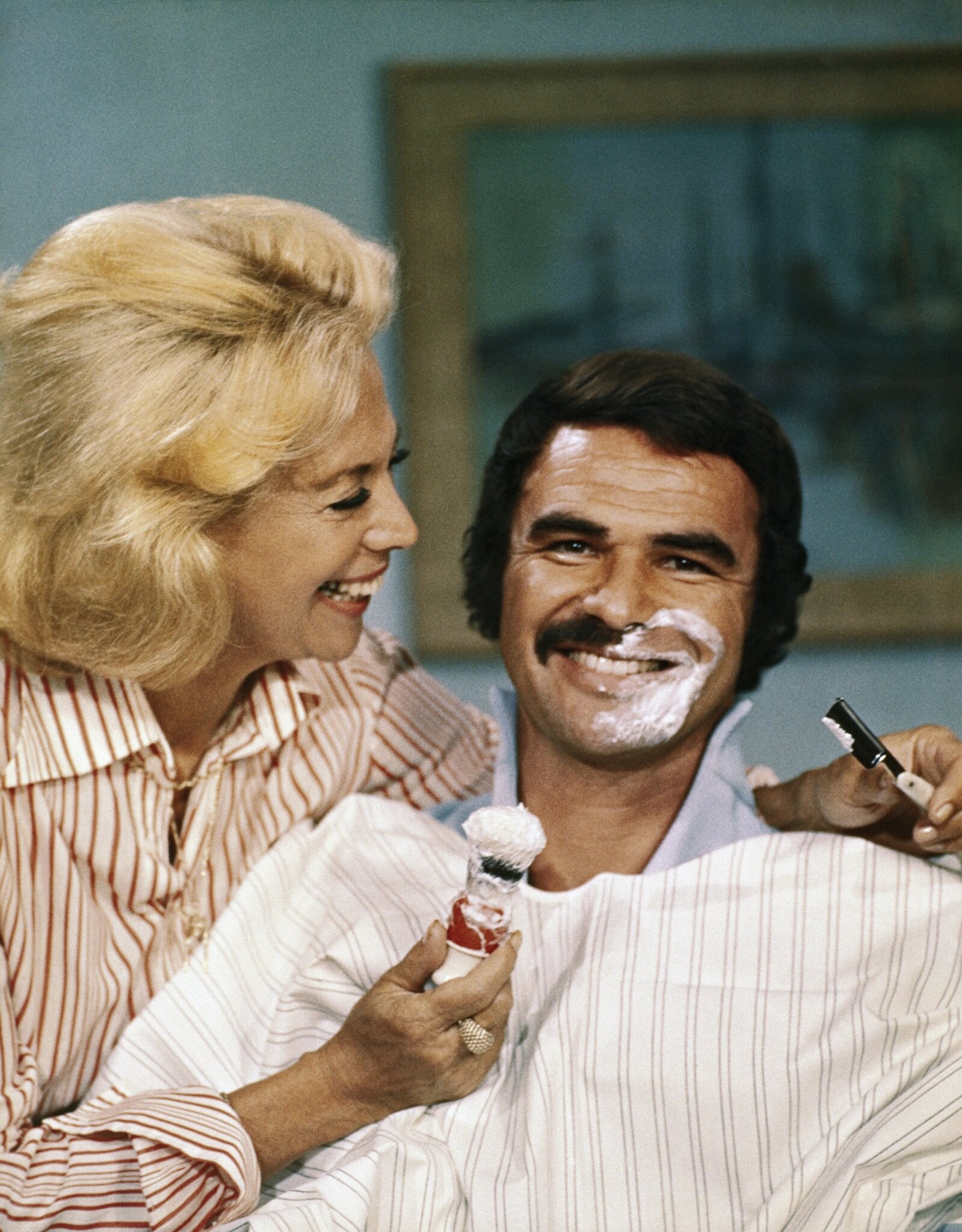 Burt Reynolds: Dinah Shore, The variety show hostess, Reynolds' trademark mustache, A 1973 television special. 1600x2050 HD Wallpaper.