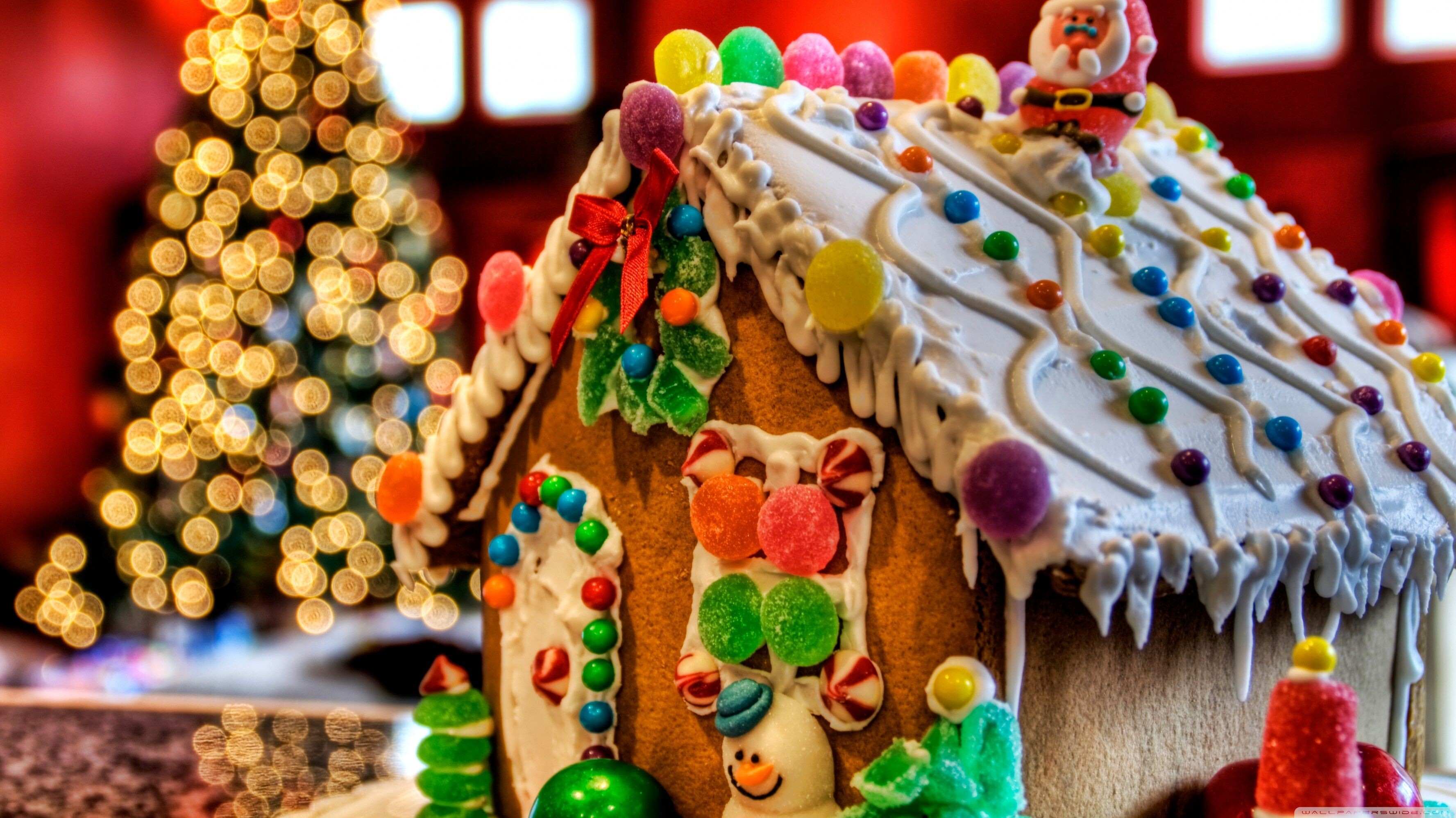 Gingerbread House: Christmas cookies, Candy decorations, Gumdrops, Jelly beans, Coating of powdered sugar snow. 3560x2000 HD Background.