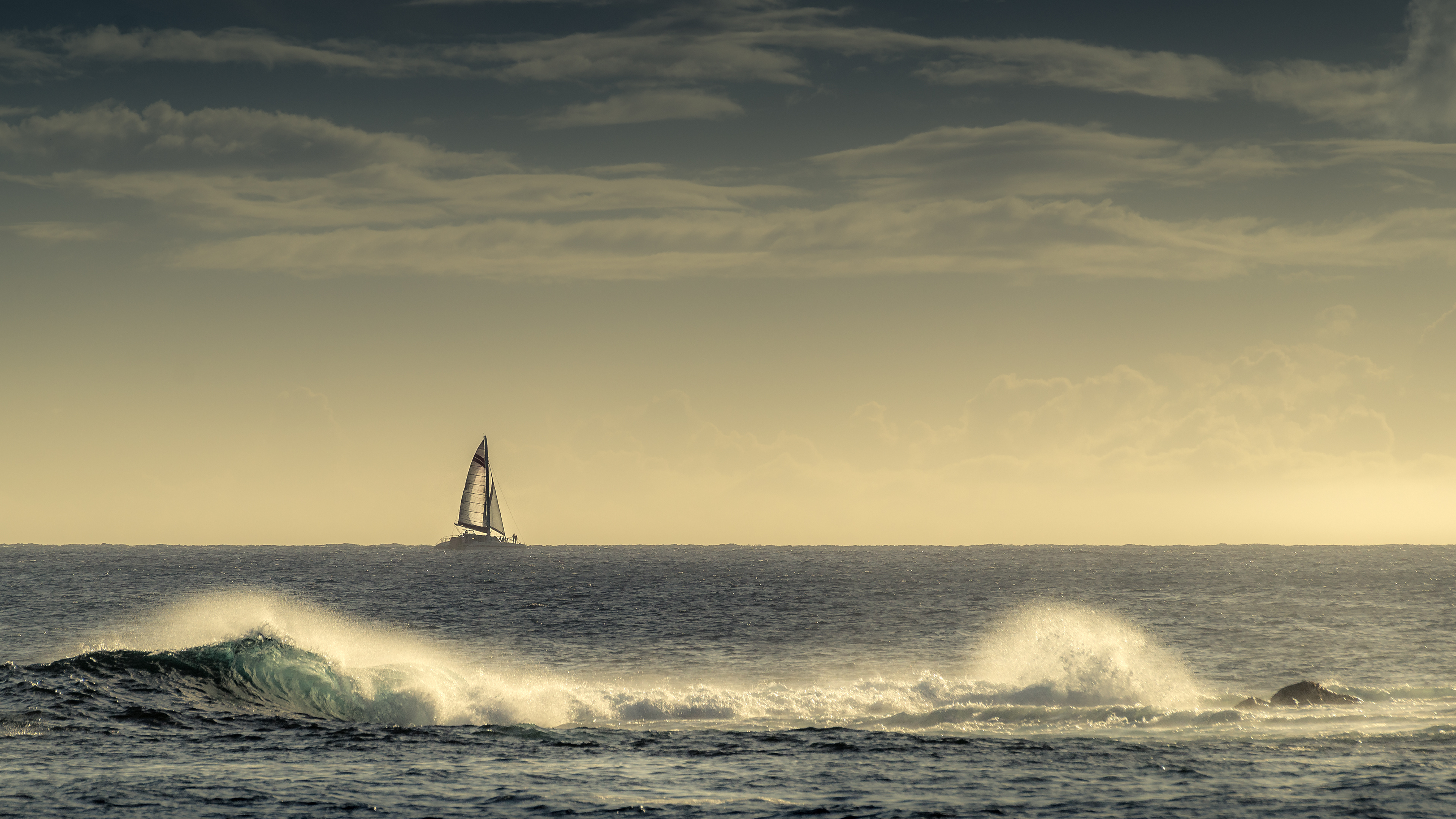 Seascape: A sailboat on its way at the horizon, Coastal waves, Endless water surface. 3840x2160 4K Wallpaper.