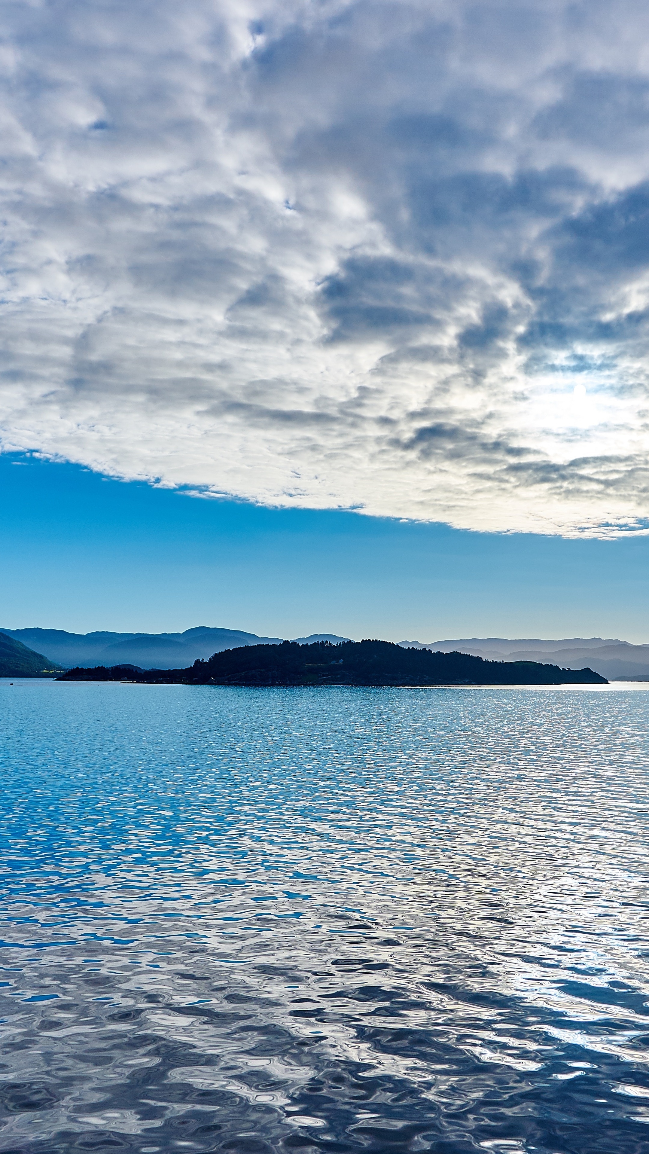 Seascape: Cloudy weather at the national park lake and a small island, Natural reserve. 2160x3840 4K Background.