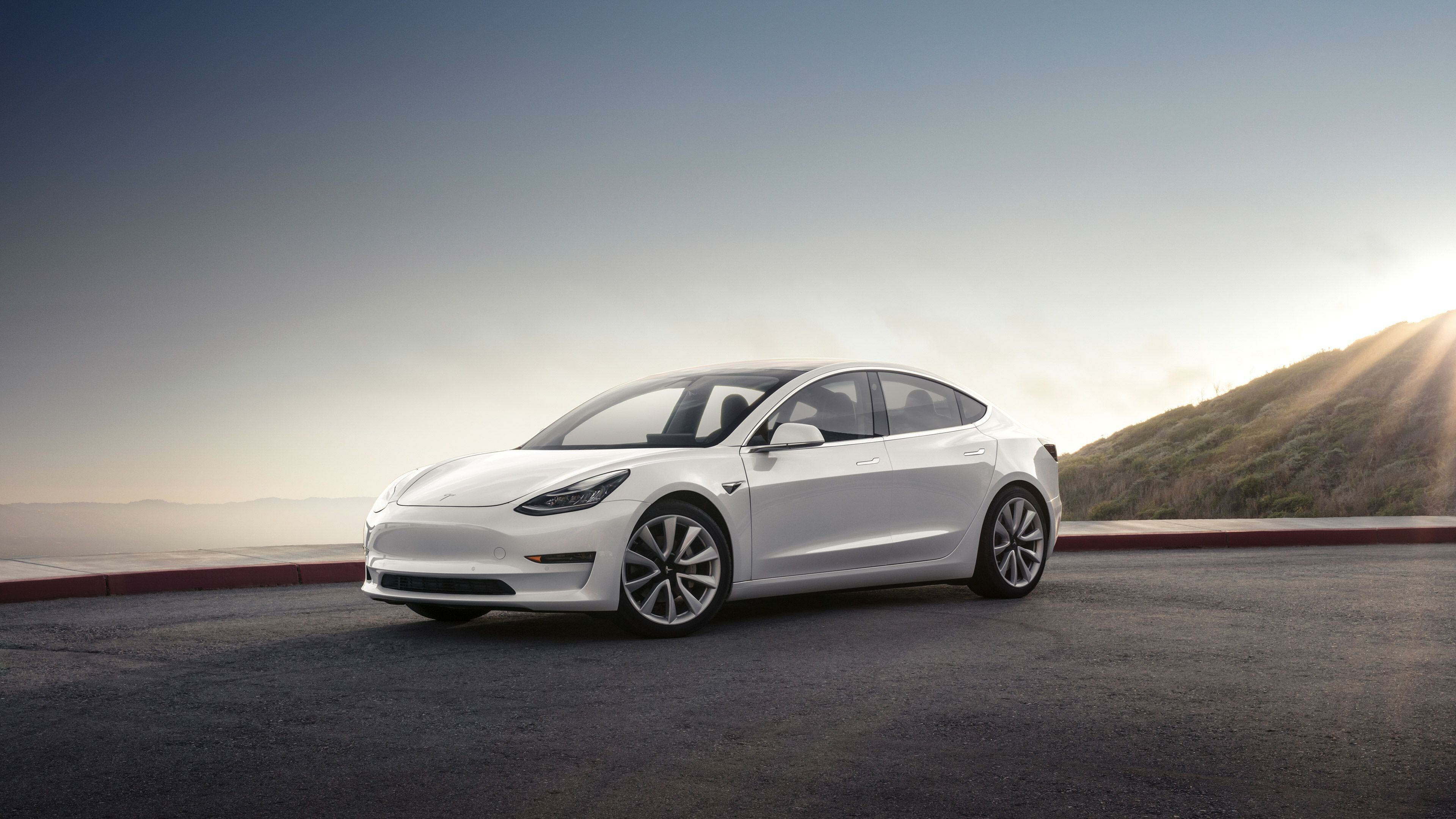 Tesla Model Y: The electric car is based on the Model 3 sedan platform. 3840x2160 4K Background.