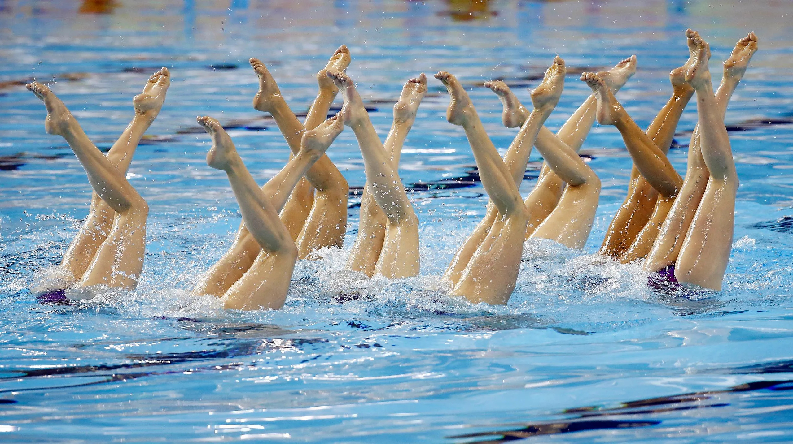 Synchronized Swimming: An artistic performance with the use of legs, Water and underwater sport. 2560x1440 HD Wallpaper.