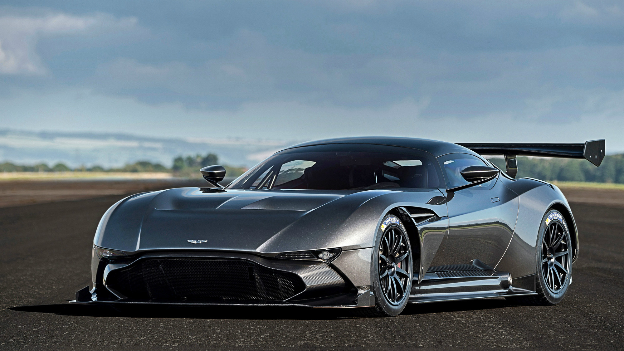 Sports Car: Dynamic driving experience, Aston Martin Vulcan. 2000x1130 HD Background.