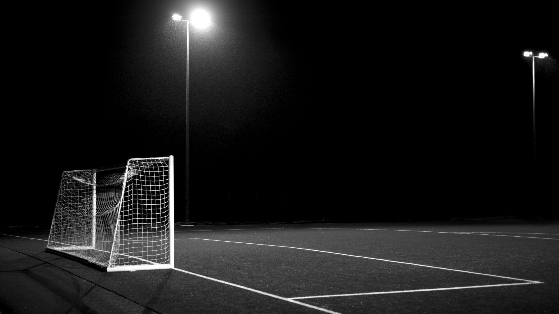 Goal (Sports): Football field at night, Monochrome, Full size soccer goal posts, Ball game. 1920x1080 Full HD Wallpaper.