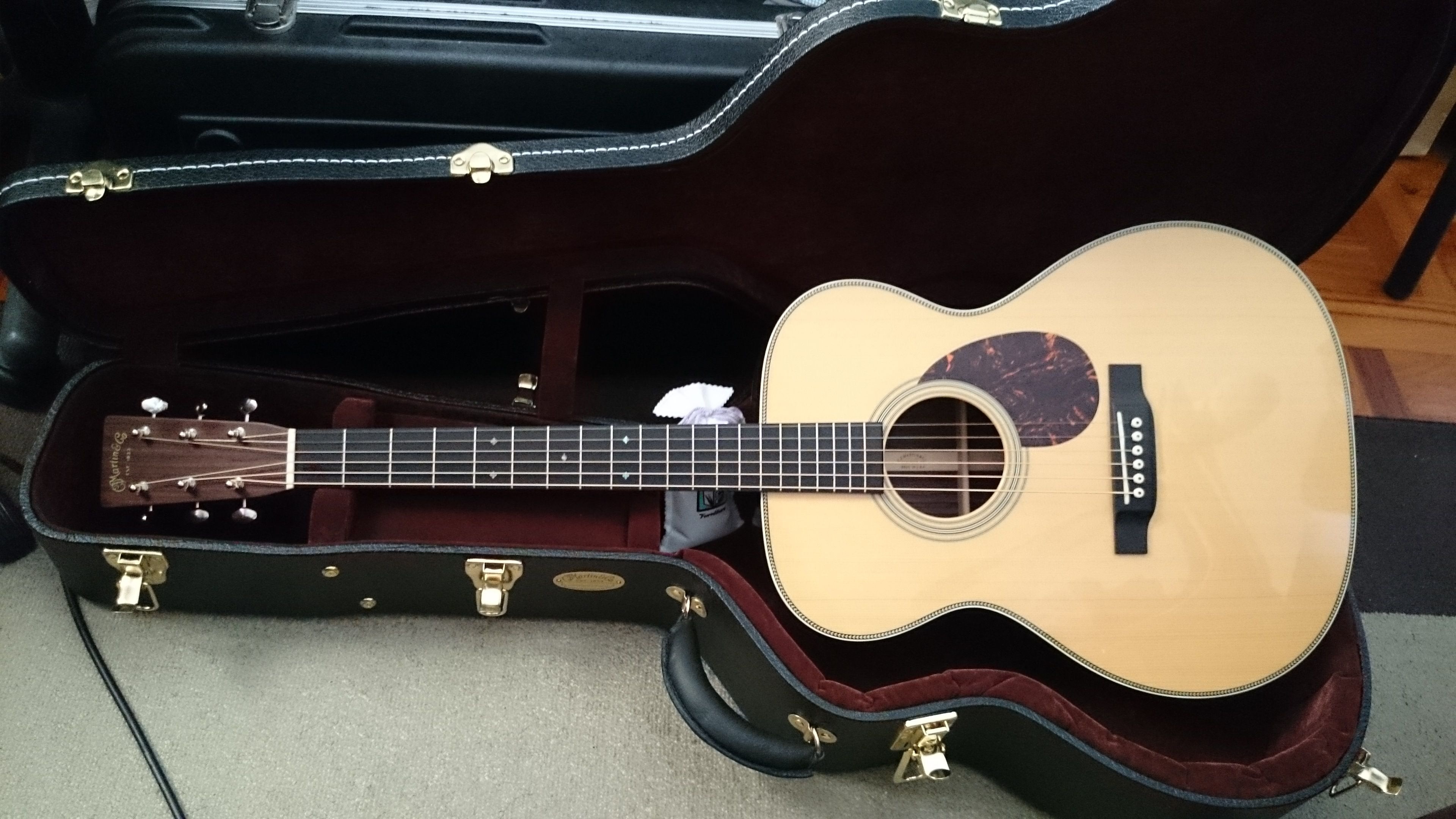 Musical Instruments: Martin OM-28 acoustic guitar, Natural with rosewood, Martin's celebrated orchestra body style. 3840x2160 4K Wallpaper.