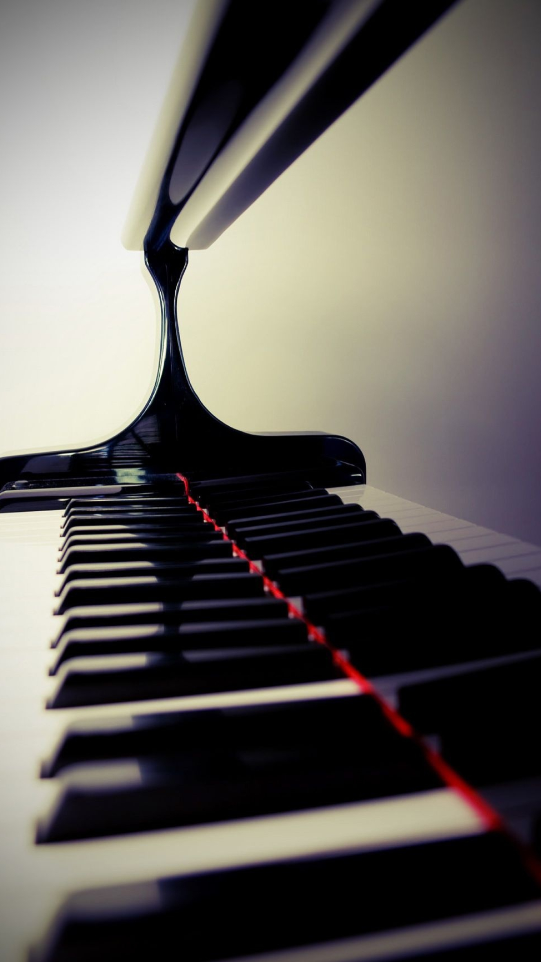 Grand Piano: Musical instrument in which the sounds are produced by striking felt hammers on the strings with the keys. 1080x1920 Full HD Background.