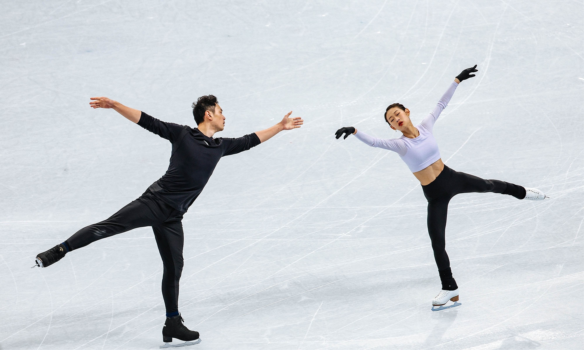 Pair Skating: Chinese Winter Olympics, Beijing, A training session, Peng Cheng and Jin Yang. 2000x1200 HD Background.
