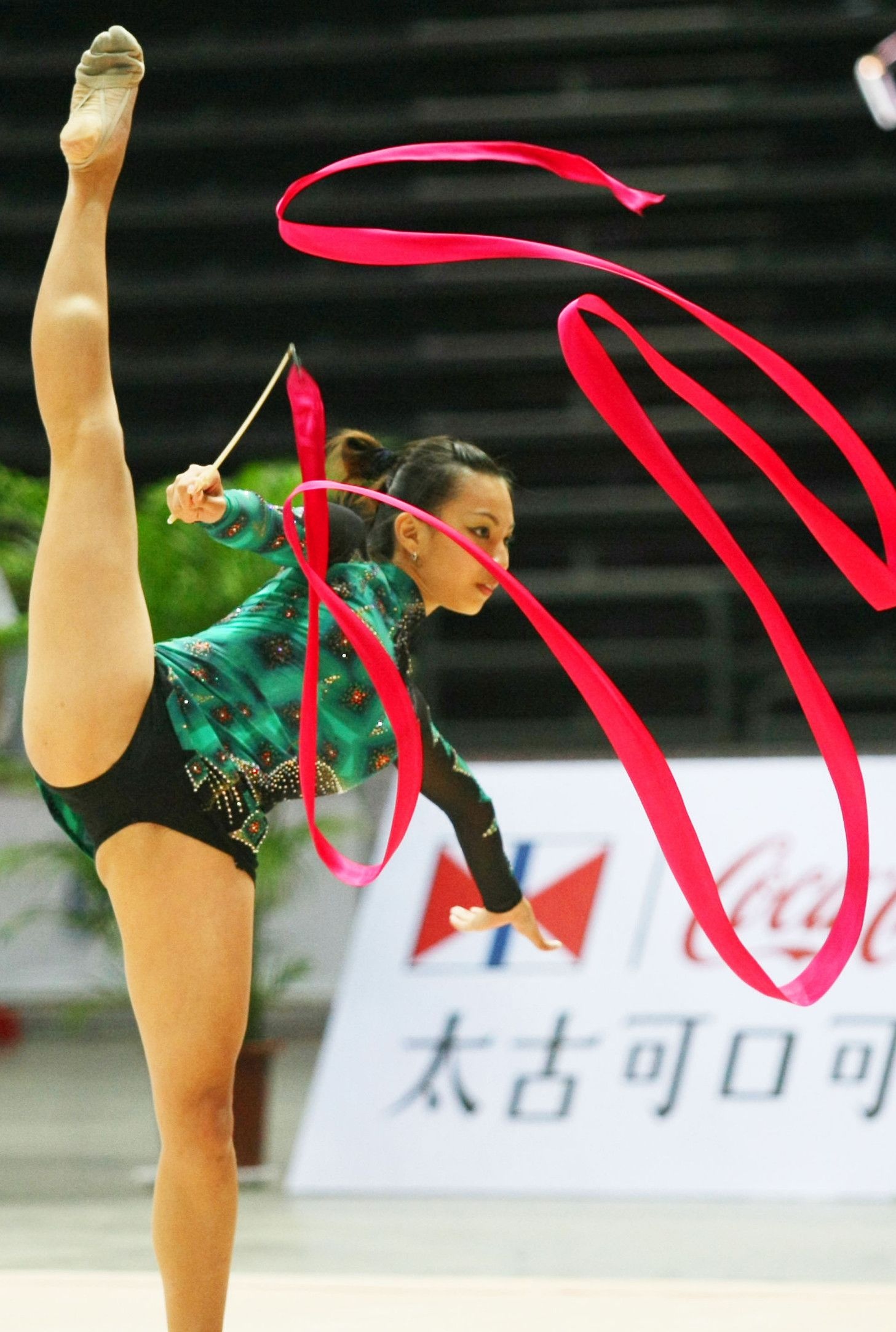 Rhythmic Gymnastics: A dance performance with a ribbon by a professional gymnast at the championship in China. 1460x2170 HD Wallpaper.