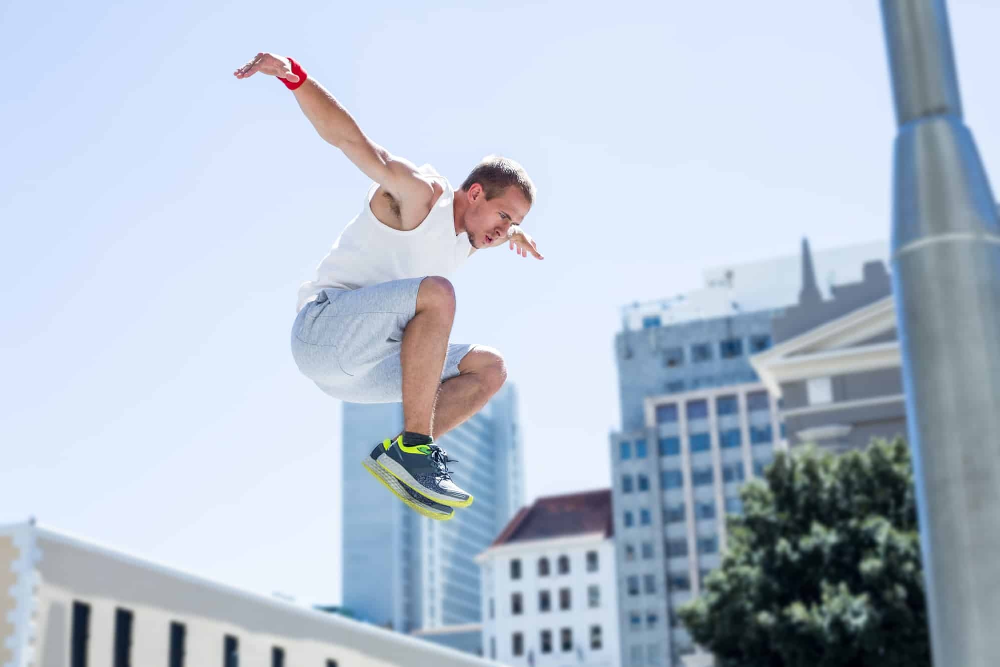 Parkour: Traceur, Balancing in the air before acting in parkour roll style. 2000x1340 HD Background.