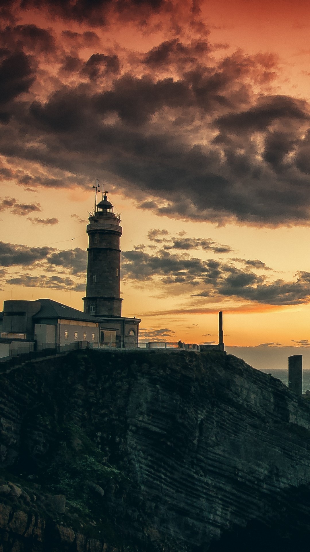 Lighthouse, 4K wallpaper, Rocks and sea, Stunning sunset, 1080x1920 Full HD Phone