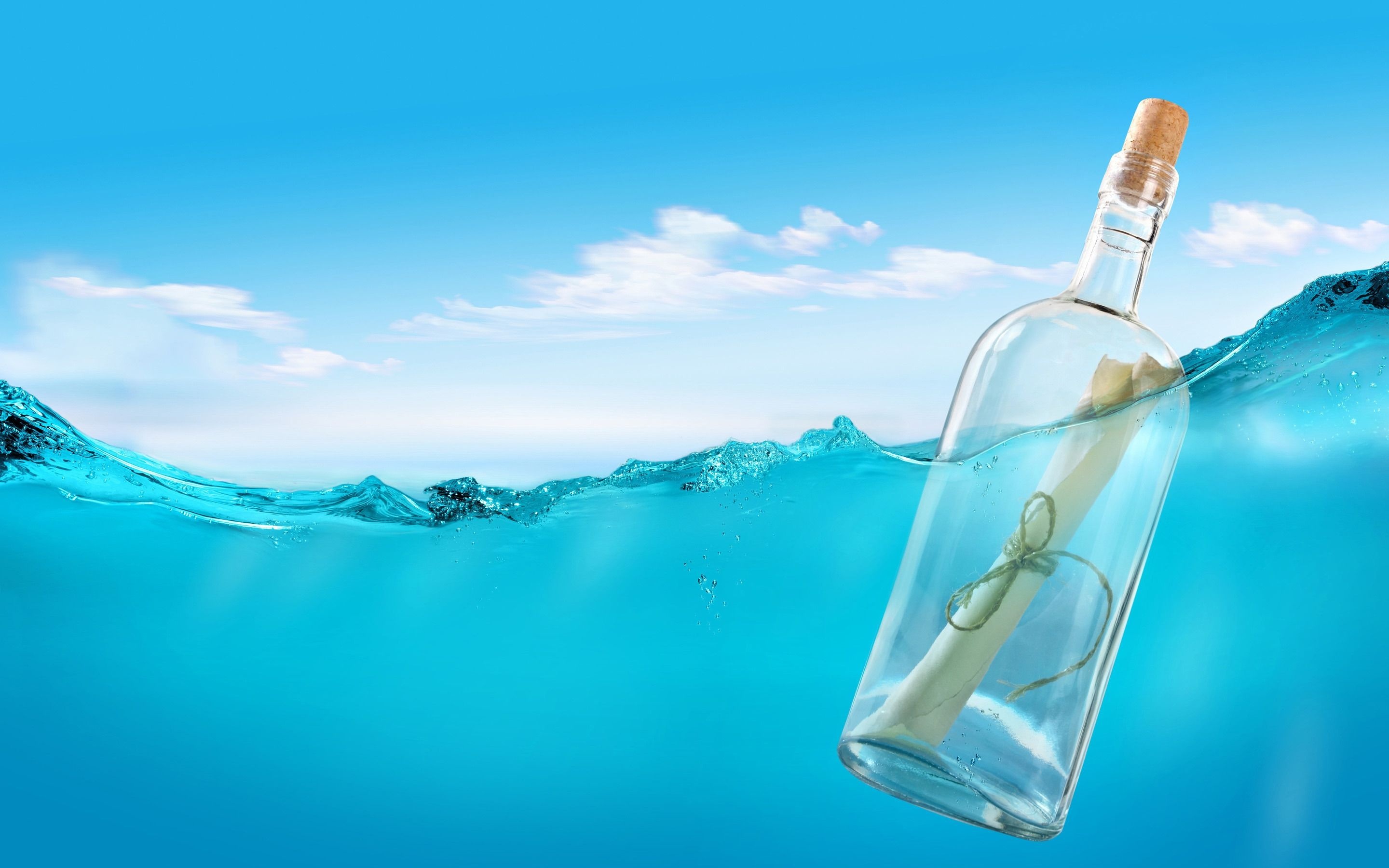 Message in a Bottle: A form of communication that involves releasing a container with a note into a body of water. 2880x1800 HD Background.