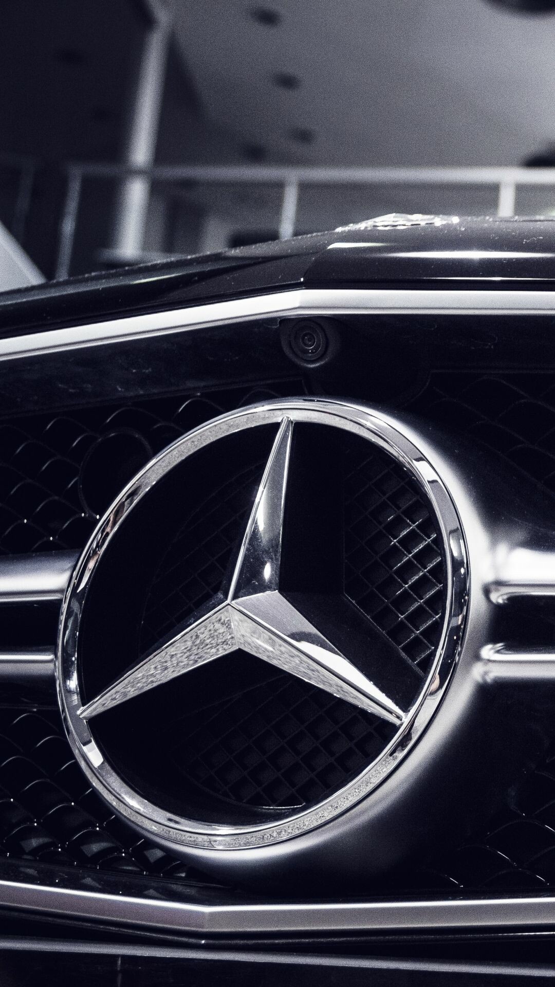 Mercedes-Benz: The logo symbolizes the use of Daimler engines on land, at sea and in the air. 1080x1920 Full HD Background.