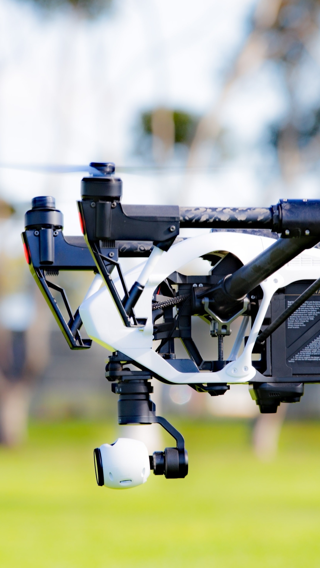 Drone: A remote control quadcopter-type model helicopter, Remotely-piloted aircraft. 1080x1920 Full HD Background.
