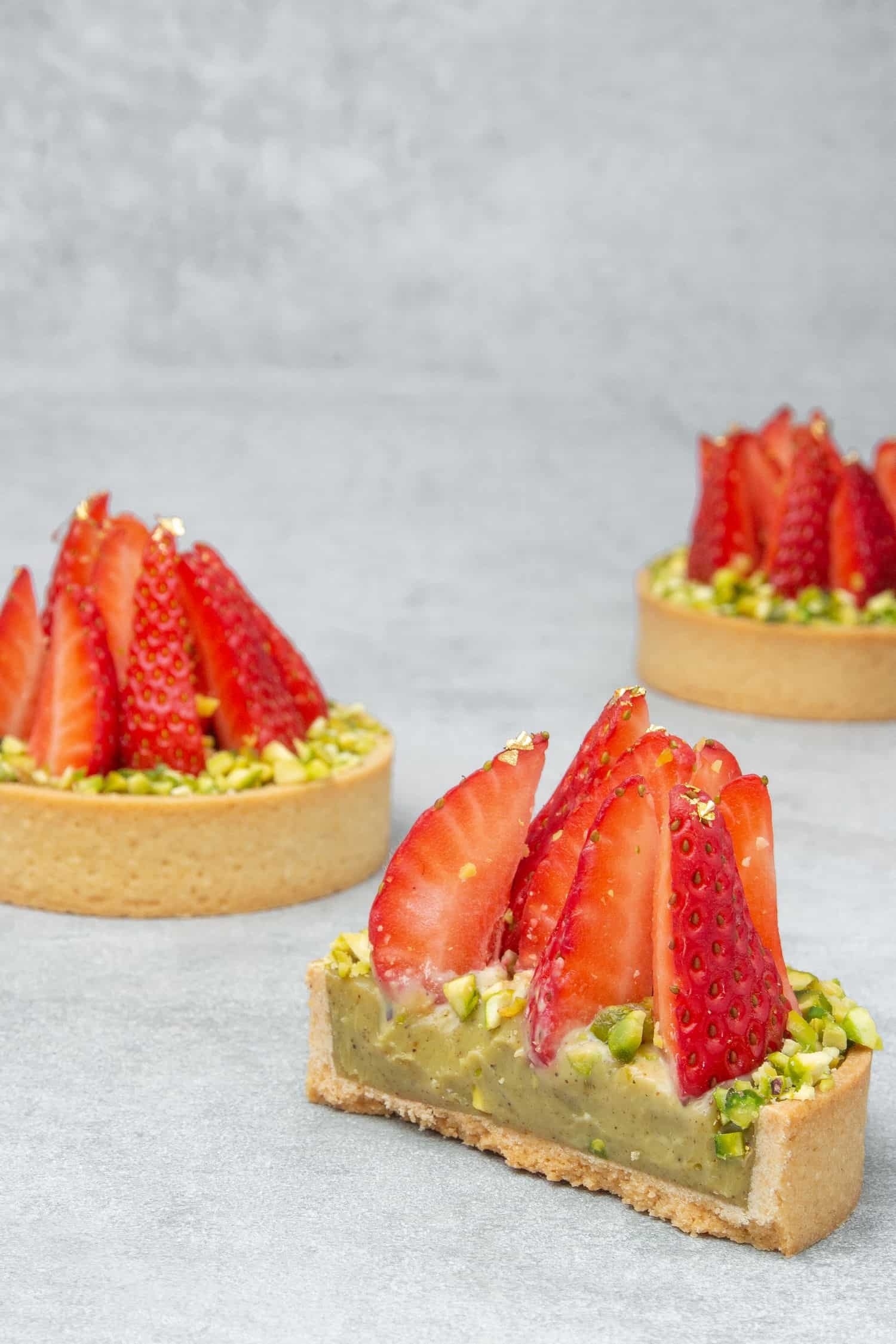 Tart: Strawberry pistachio pie, Shallow, round shape with a pastry crust base. 1500x2250 HD Wallpaper.