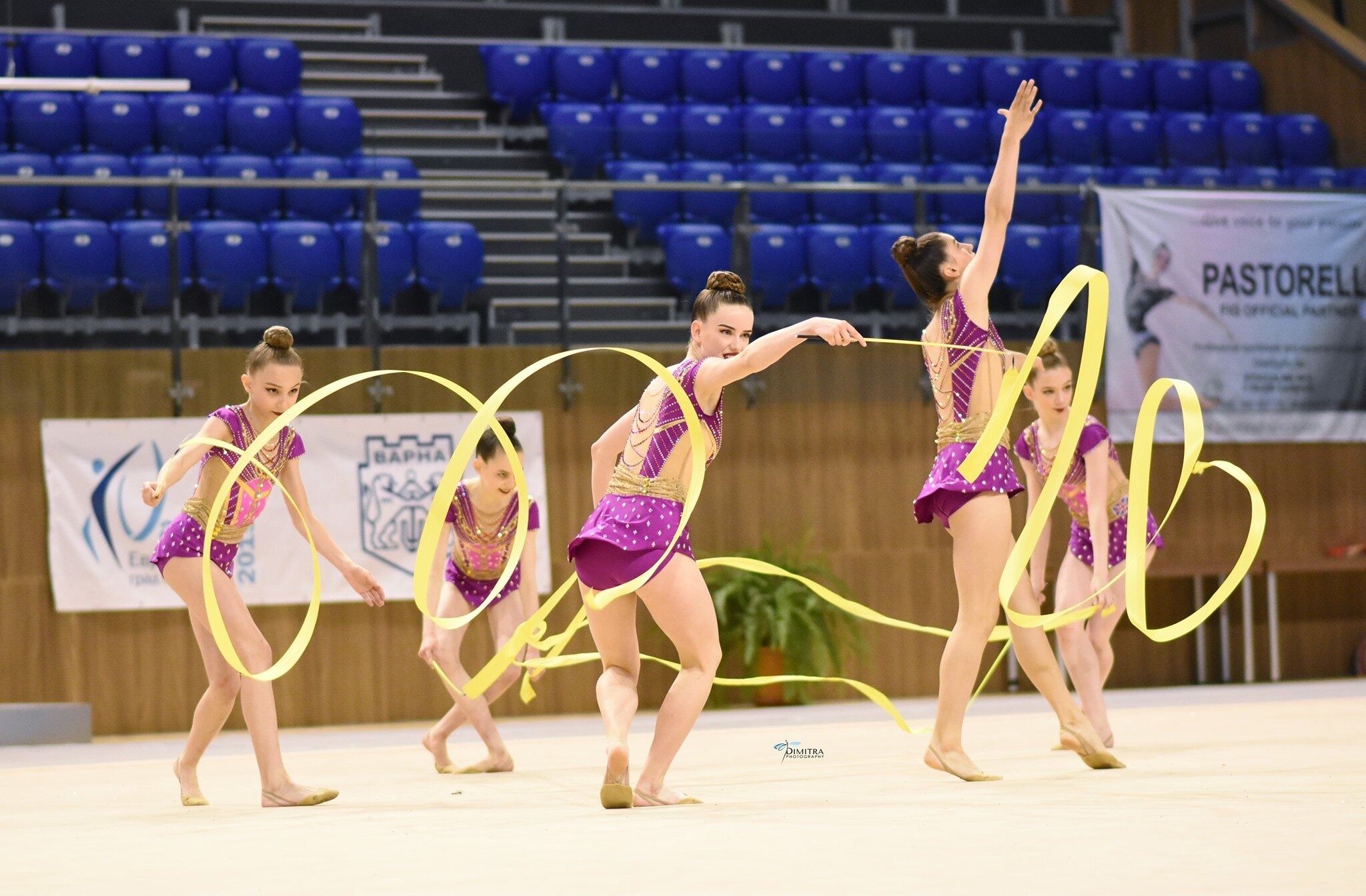 Rhythmic Gymnastics: Group performance by young gymnasts equipped with yellow ribbons, Artistic sport. 2050x1350 HD Wallpaper.