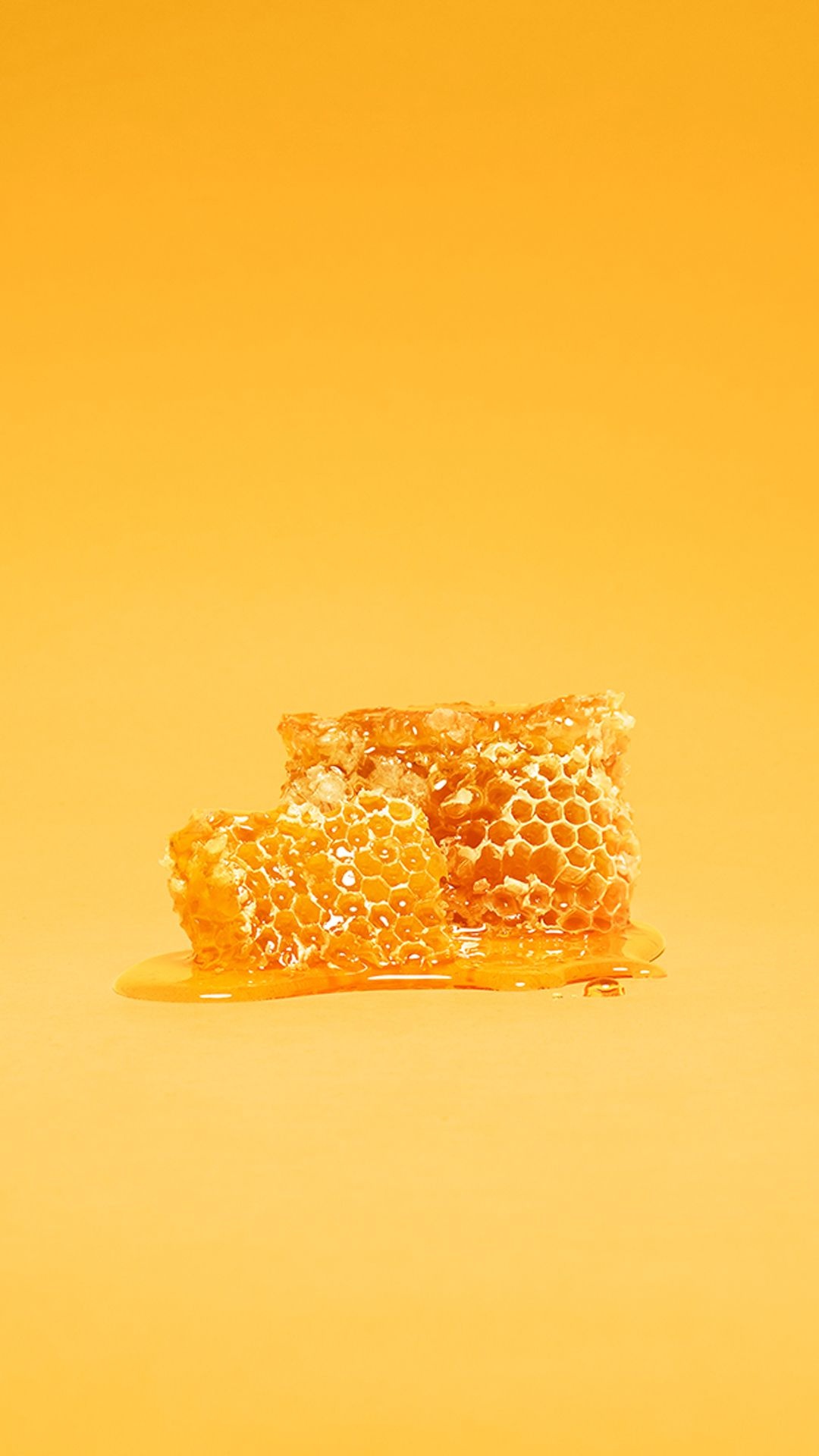 Honey: Sweet, viscous liquid food, dark golden in color. 1080x1920 Full HD Background.