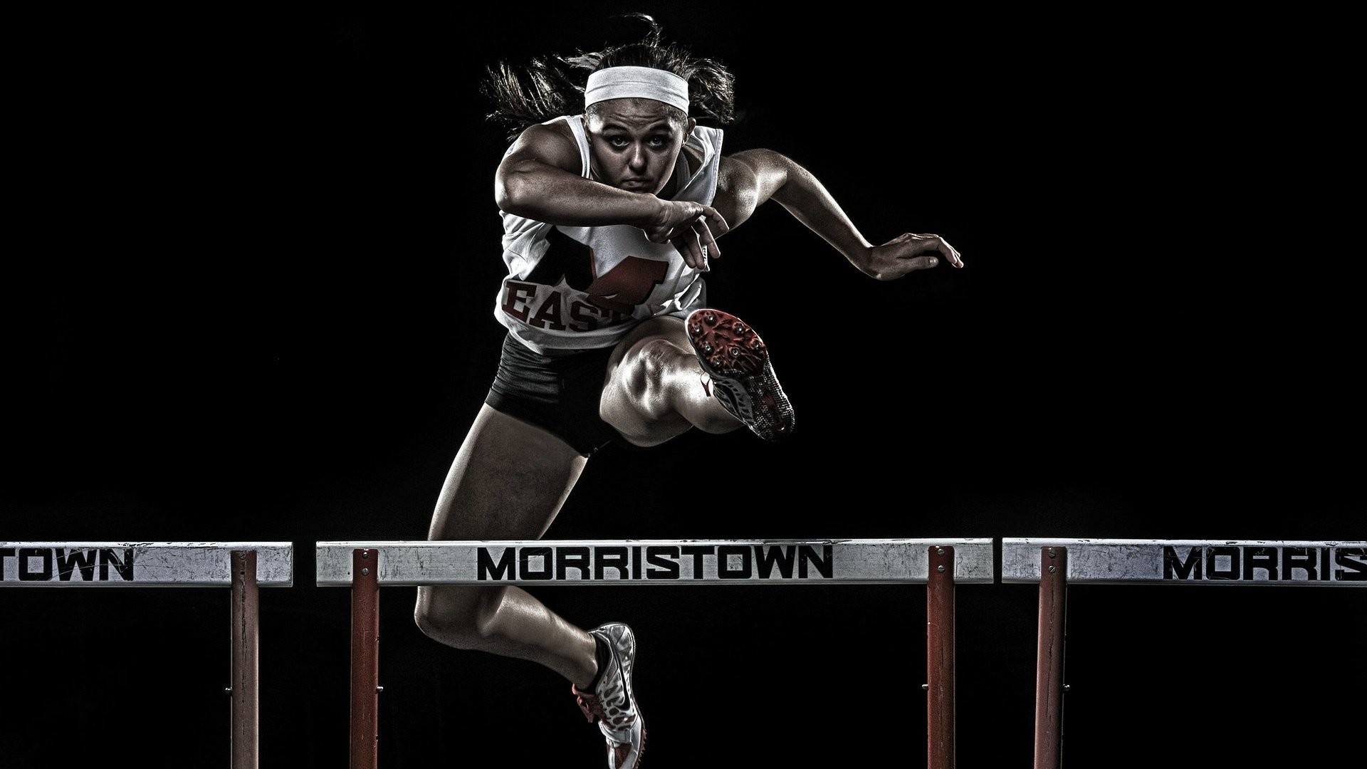Hurdling: Track and field athletics, The sport of racing over hurdles, Short distance running, Morristown, Athlete. 1920x1080 Full HD Background.