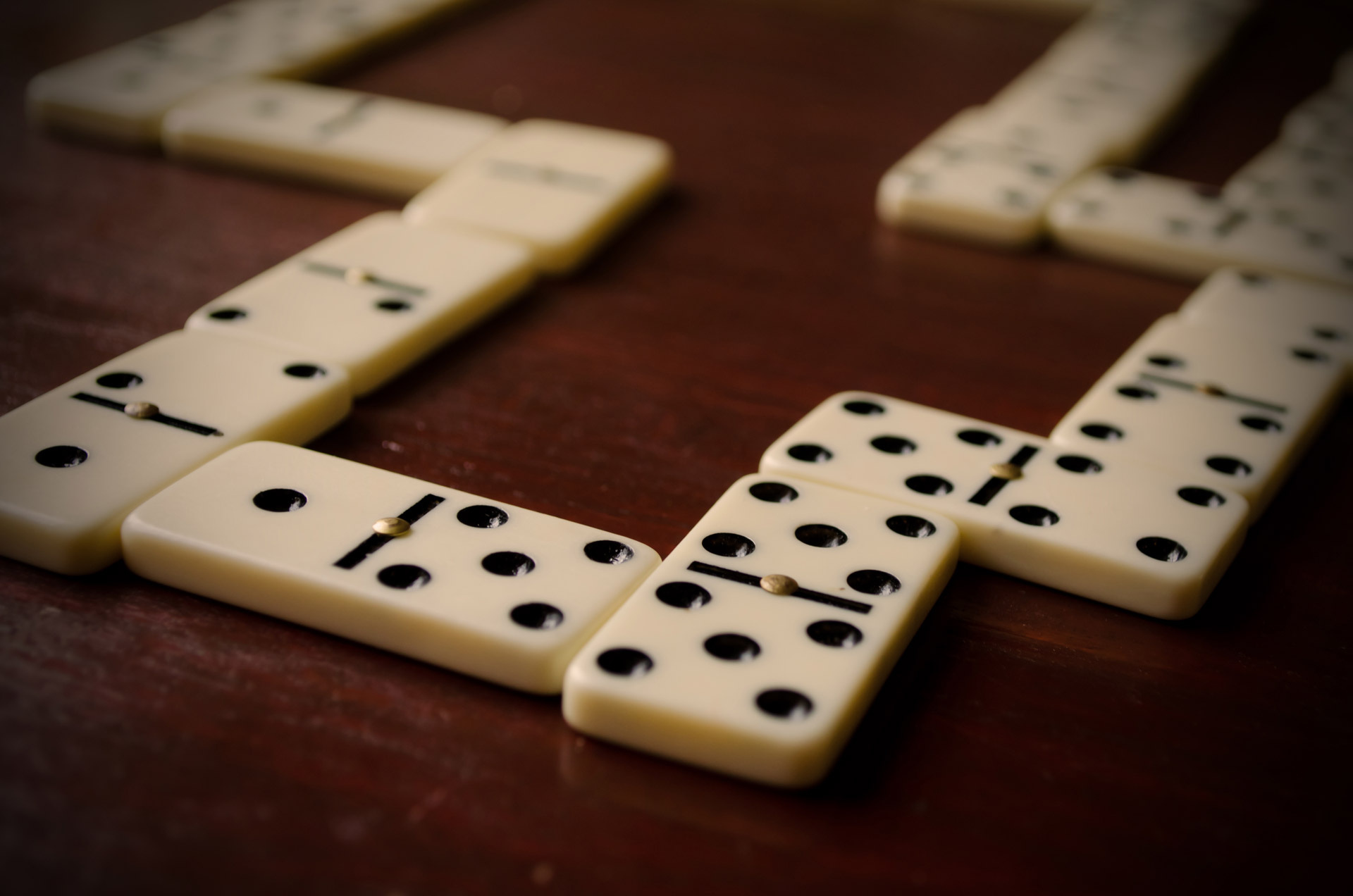Dominoes: The ongoing game of Matador, The doubles are placed in parallels rather than perpendicular to the line. 1920x1280 HD Background.