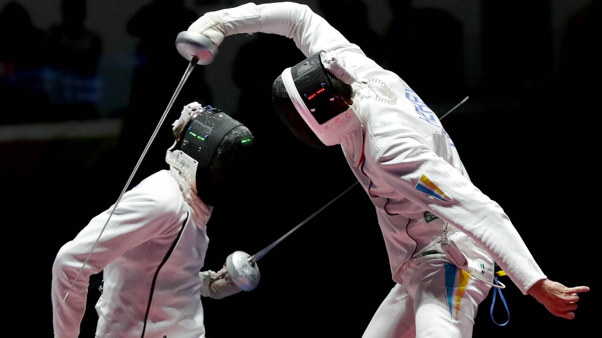 Fencing: Ukrainian foil fencer tries to escape a strike of his opponent, Competitive combat sport. 1920x1080 Full HD Wallpaper.