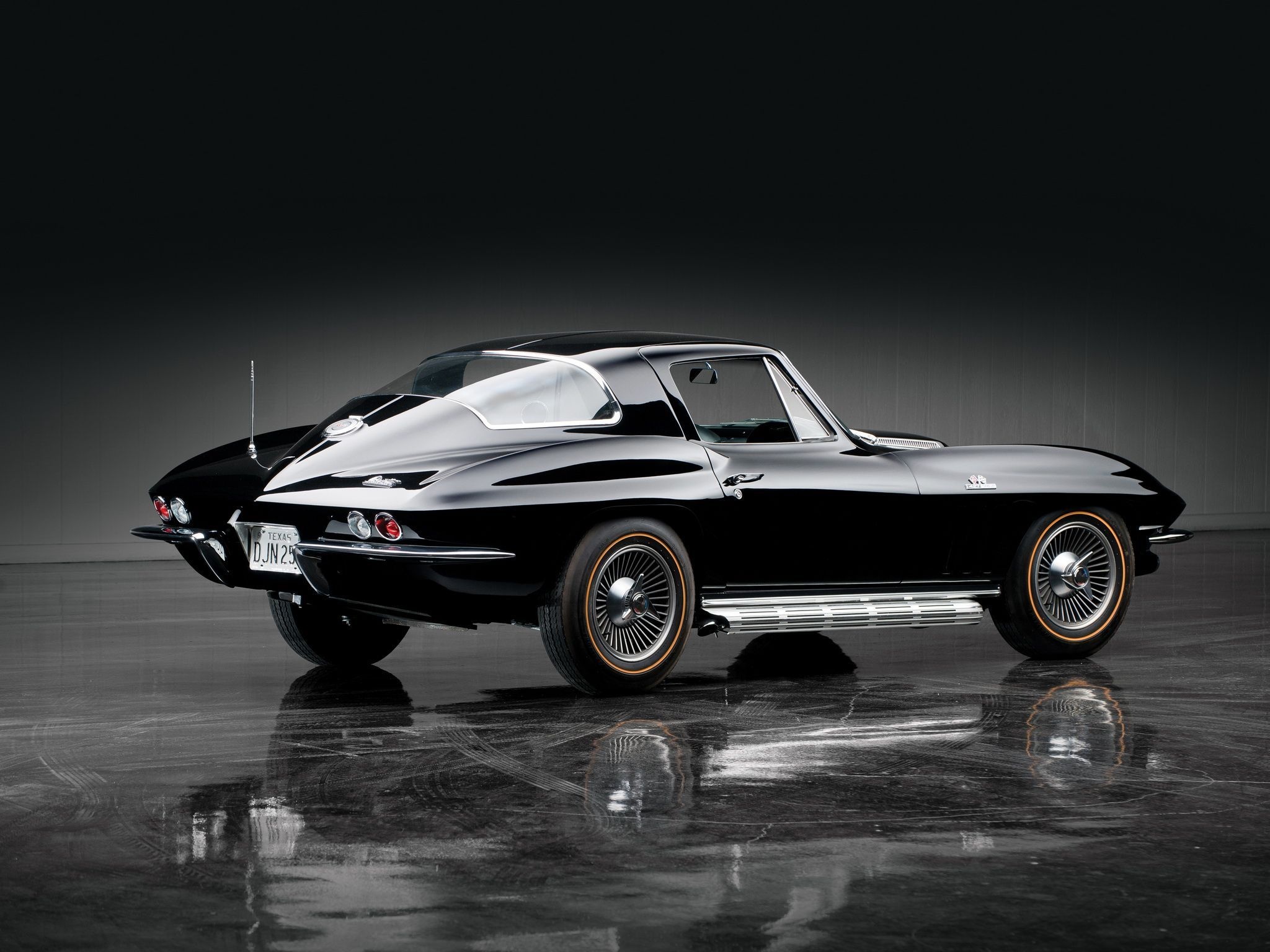 Corvette: Sting Ray C2 of 1965, Metallic black, A high-performance vintage sports car. 2050x1540 HD Wallpaper.