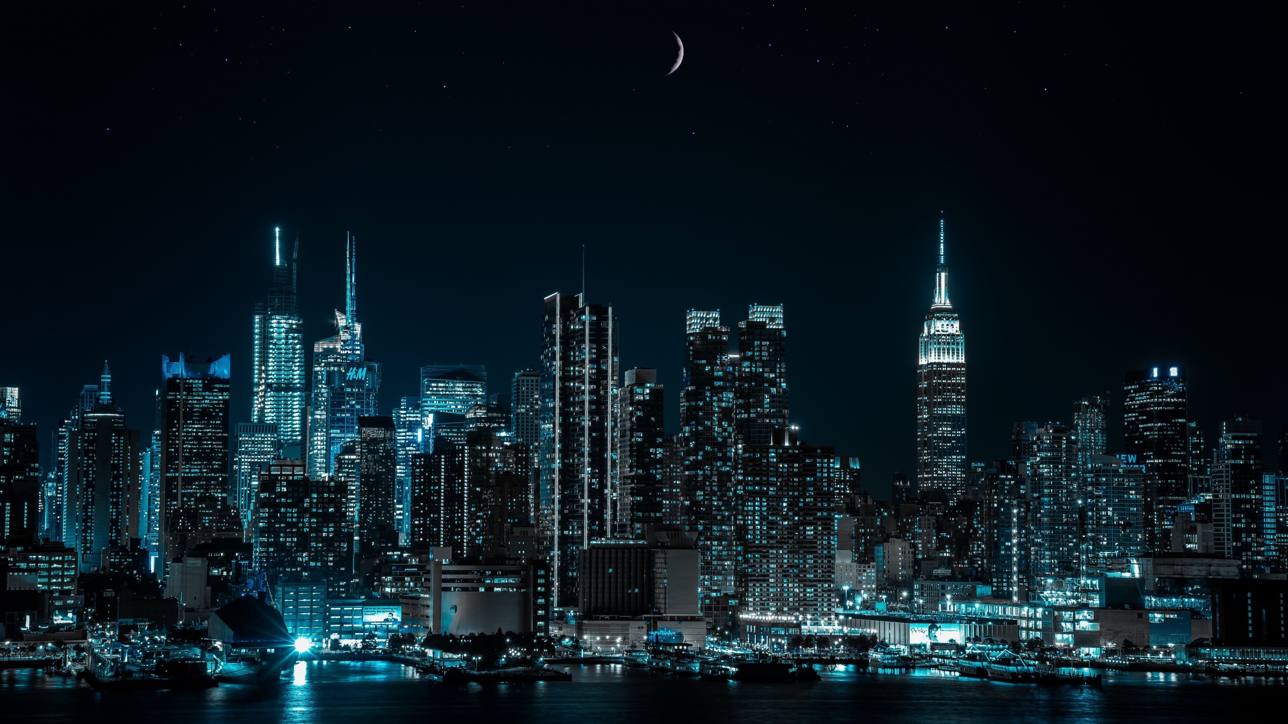 Manhattan skyline at night, New York City lights, Half moon backdrop, Stunning cityscape, 2560x1440 HD Desktop