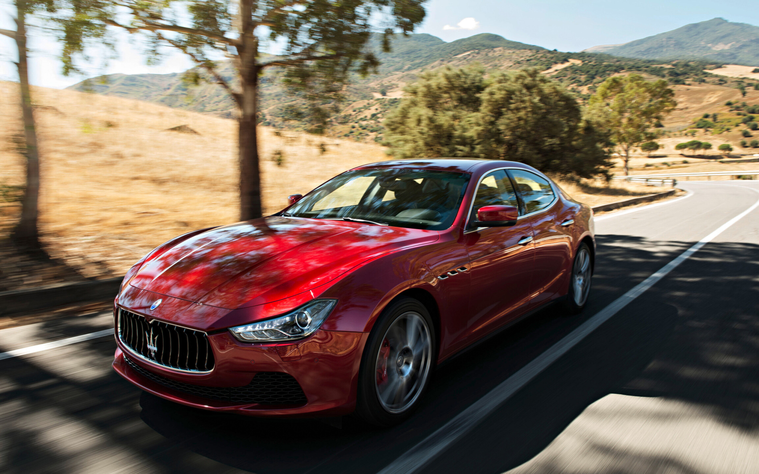 Maserati: The company's headquarters are now in Modena, and its emblem is a trident. 2560x1600 HD Background.