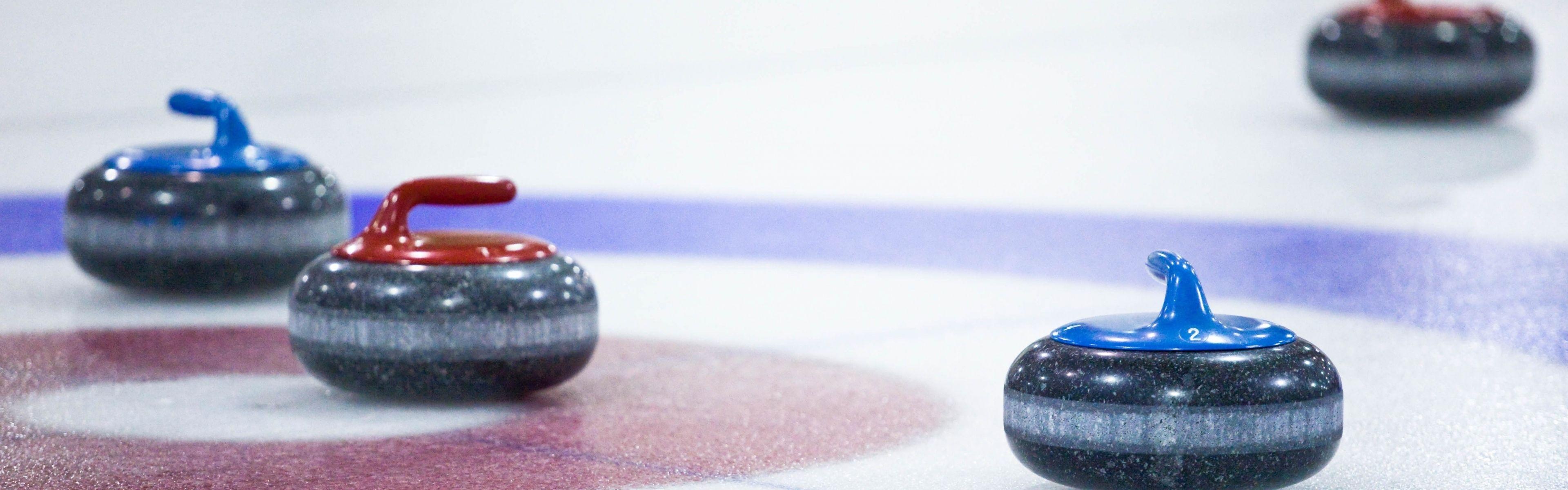 Curling: The granite rocks, Primary equipment for a popular competitive winter game. 3840x1200 Dual Screen Background.