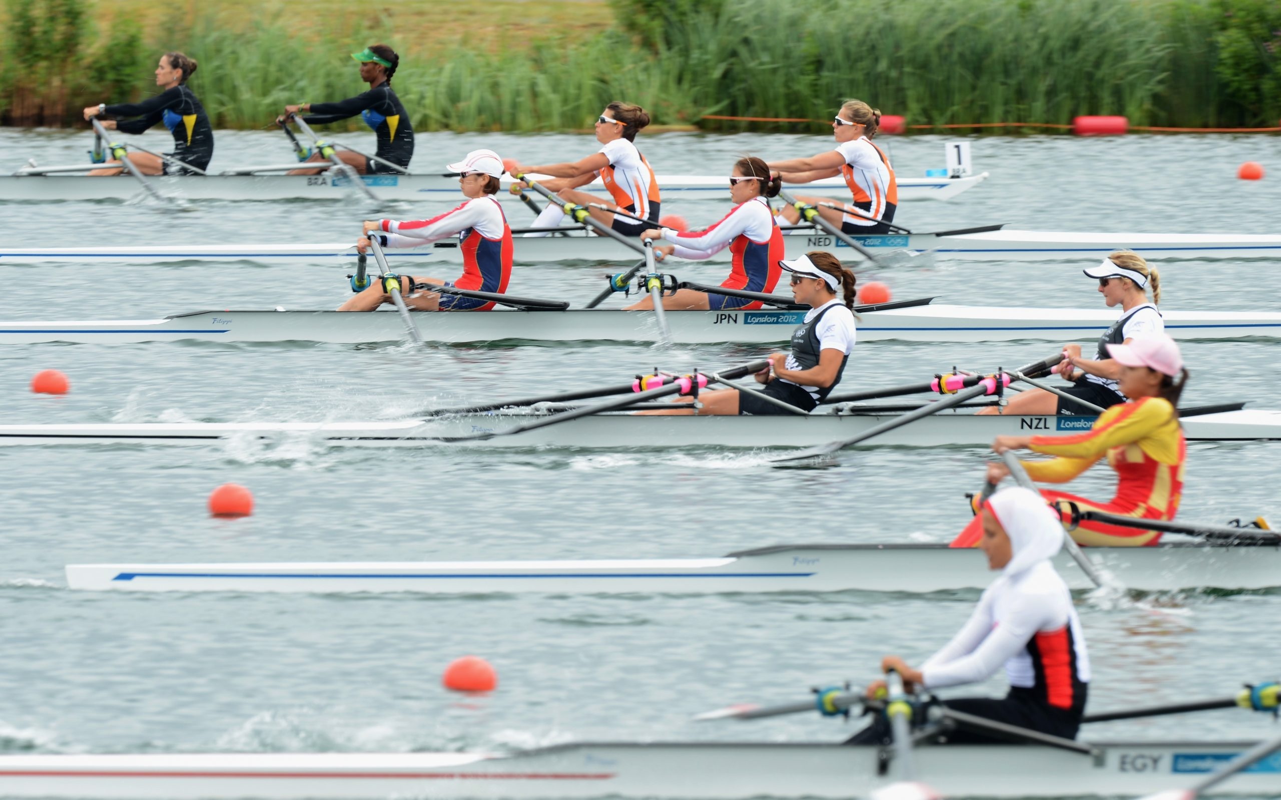 Rowing: Teams of Egypt, Japan, New Zealand and the Netherlands, Sculling event at the World Rowing Championships. 2560x1600 HD Background.