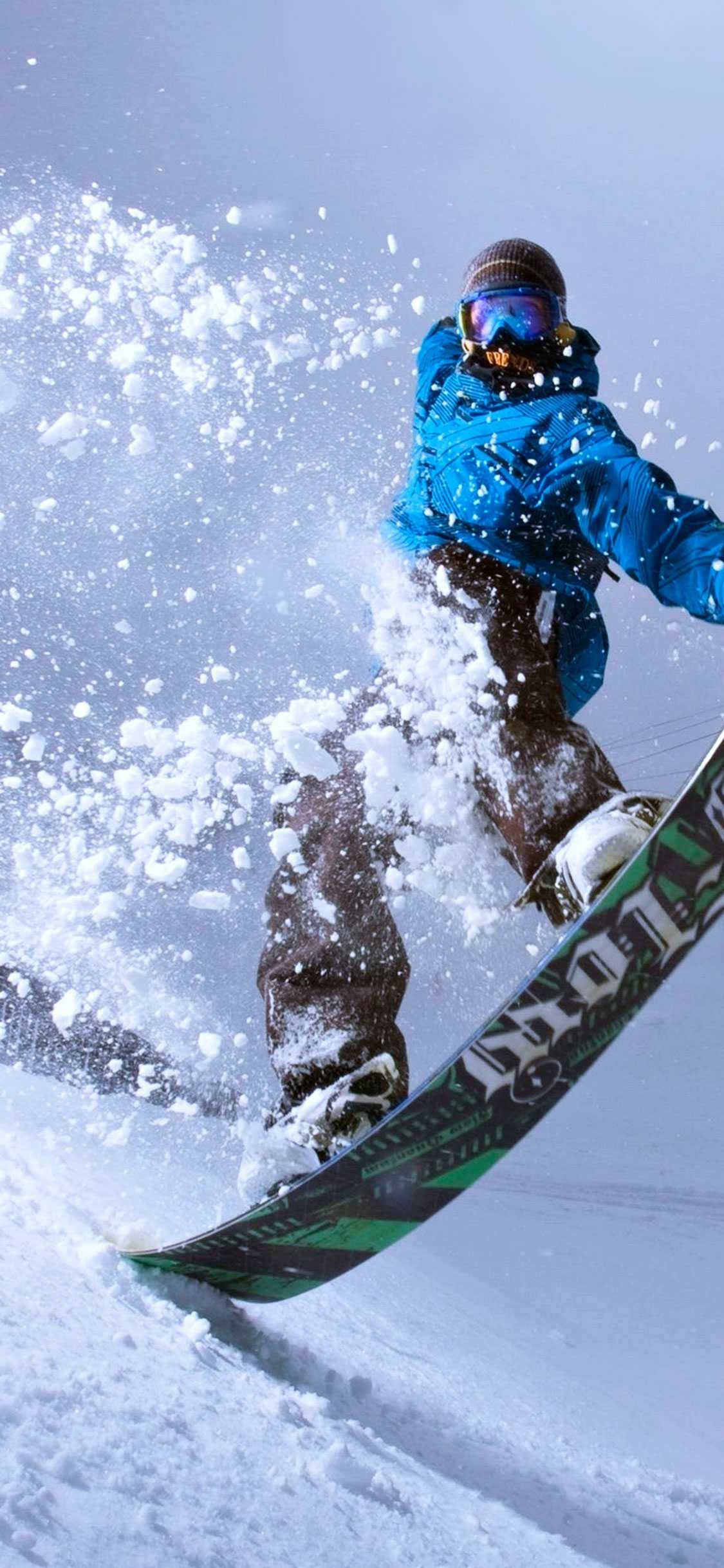 Snowboarding: Off-piste snowboarding style, Freeriding winter sport, Extreme activity. 1130x2440 HD Background.