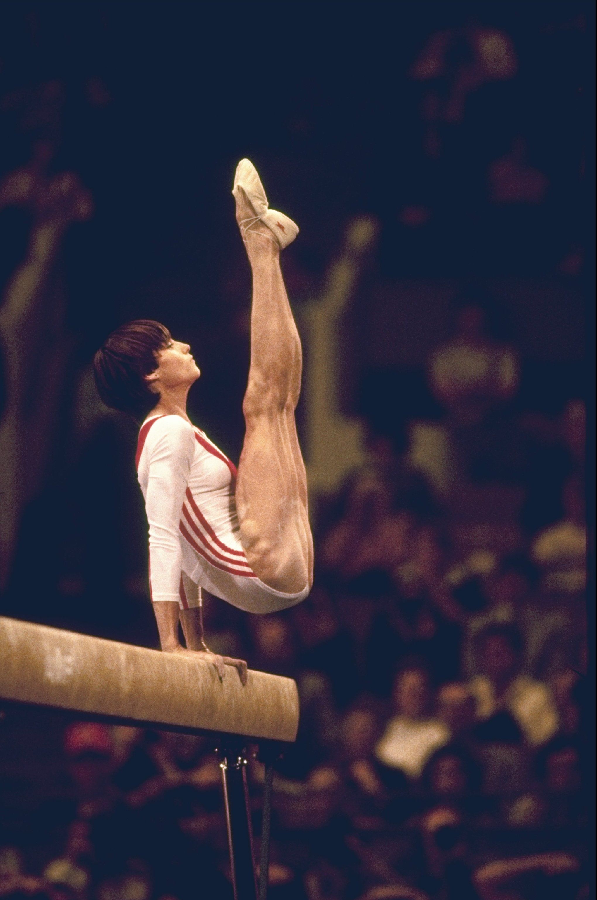 Balance Beam: Nadia Comaneci, A Romanian retired gymnast and a five-time Olympic gold medalist. 2040x3080 HD Background.