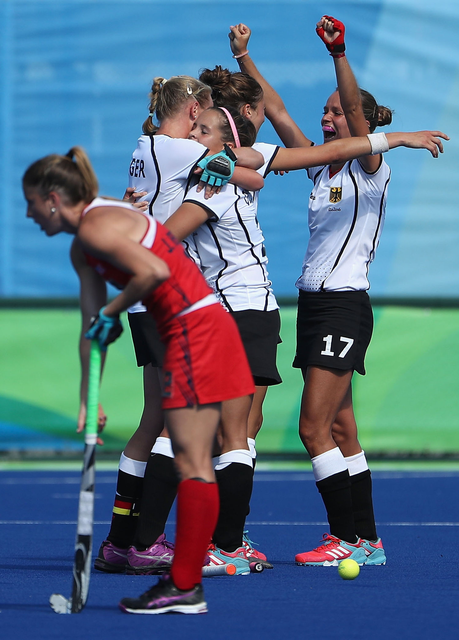 Field Hockey: Jana Teschke of Germany celebrates with teammates after defeating the US at the Rio 2016 Olympic Games. 1470x2050 HD Background.