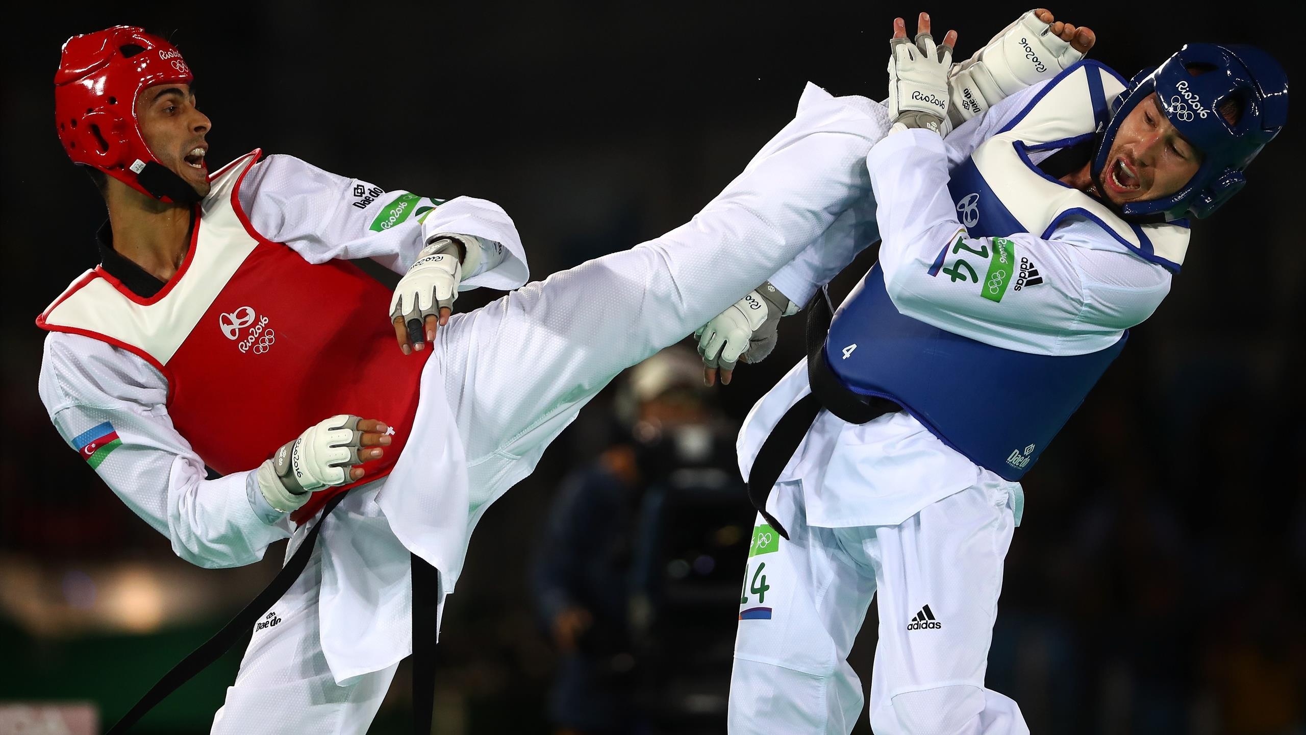Taekwondo: Liu Wei-Ting vs. Milad Beigi Harchegani, 2020 Tokyo Summer Olympics. 2560x1440 HD Background.