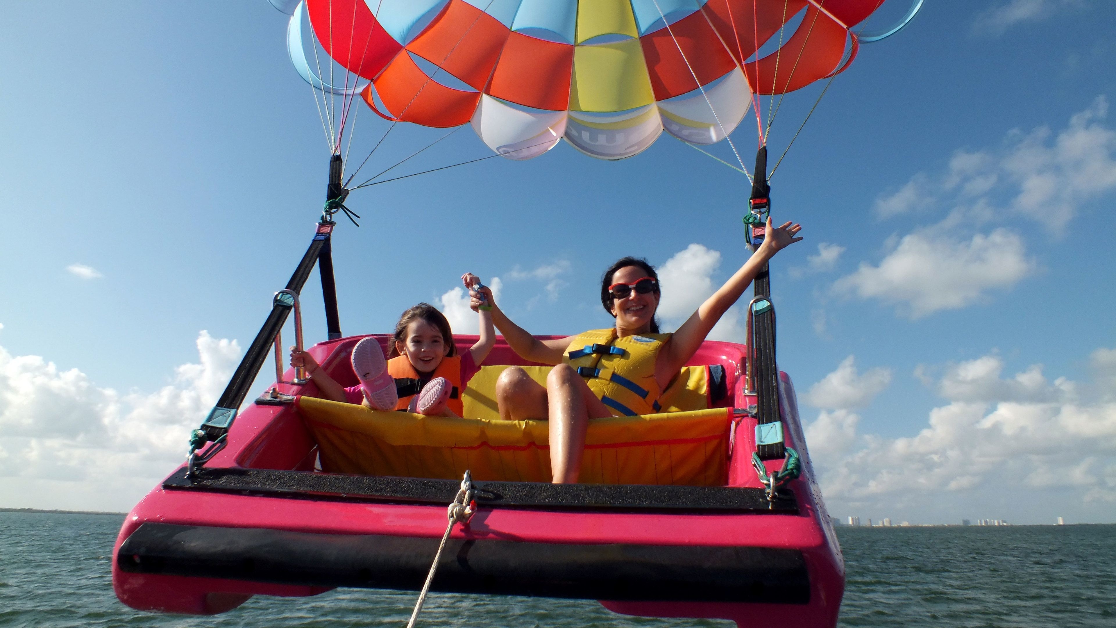 Parasailing: Sky Rider, The Caribbean Sea, Parakiting in Cancun, People parasail behind the boat. 3840x2160 4K Background.