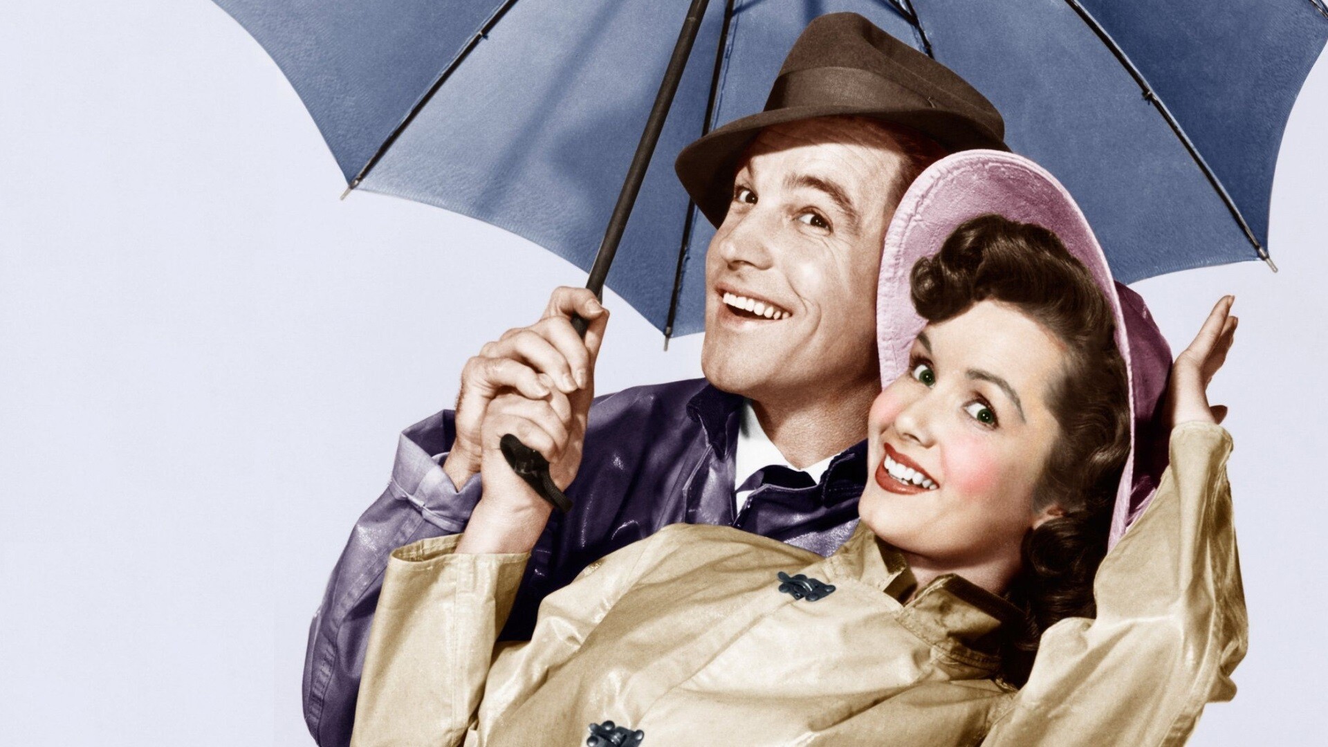 Singin' in the Rain: Gene Kelly portrayed a studio star who falls in love with an aspiring actress, played by Debbie Reynolds. 1920x1080 Full HD Background.