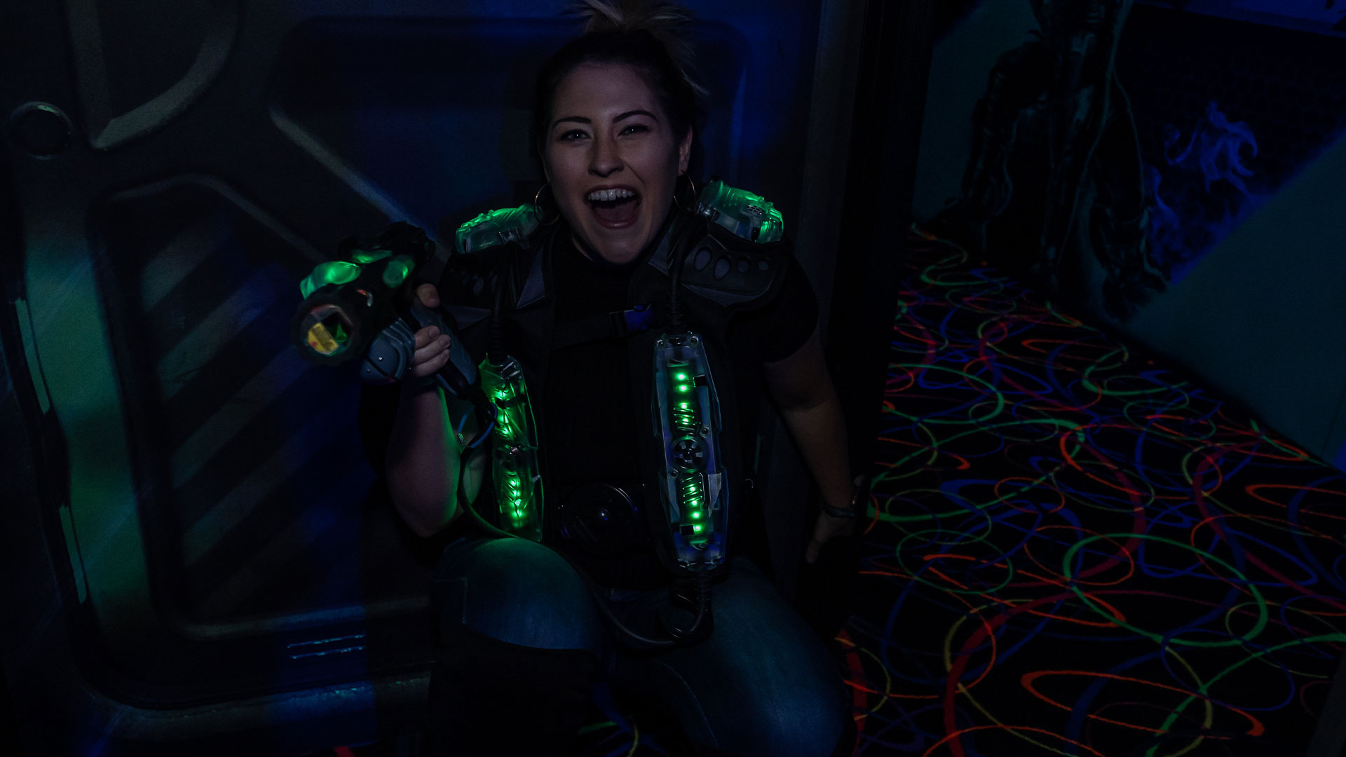 Laser Tag: Fully equipped female lights guns player, Recreational activity. 1920x1080 Full HD Background.