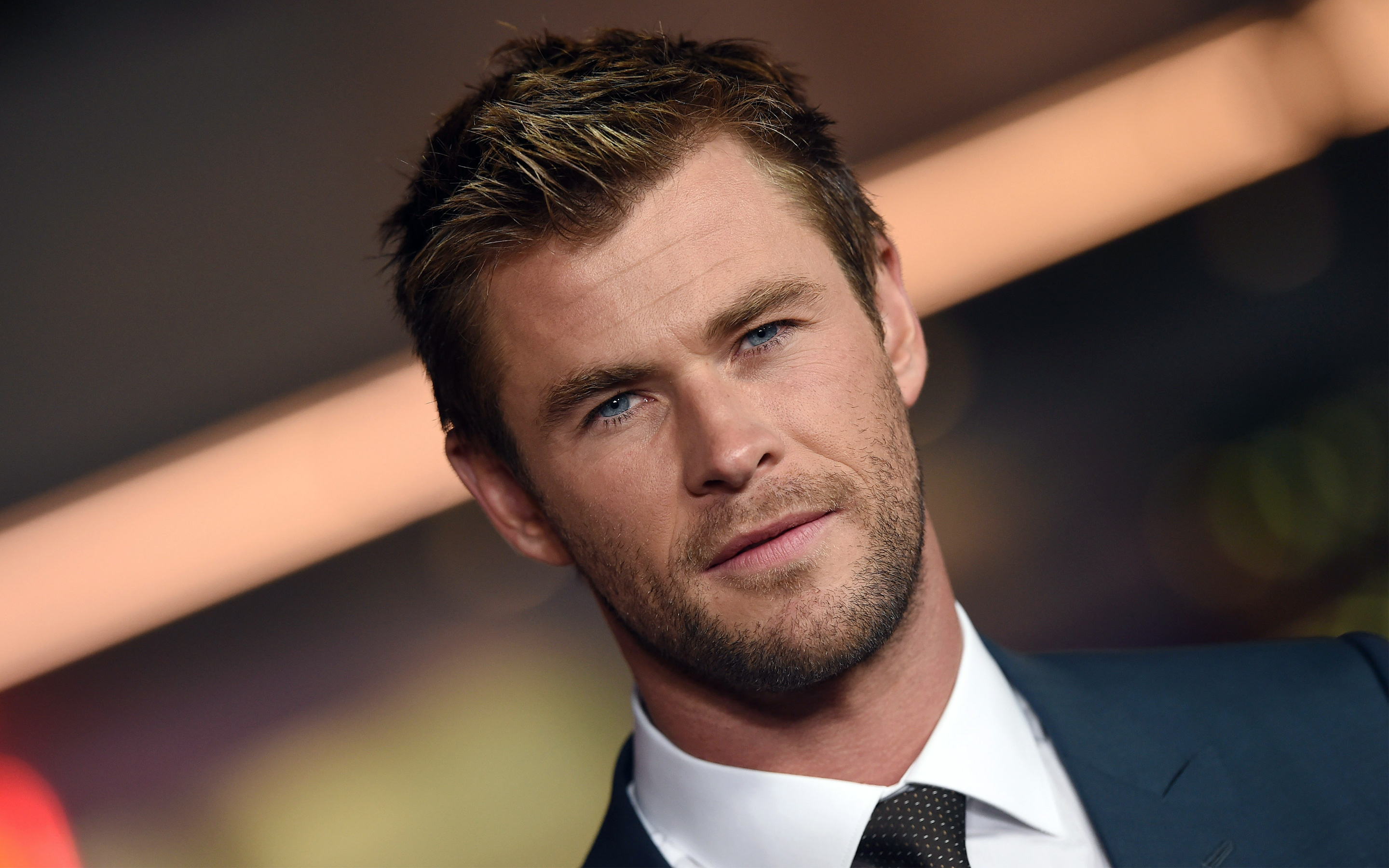 Chris Hemsworth: Gained worldwide recognition for his recurring role as “Thor” in Marvel's “Thor” and “Avengers” movies. 2880x1800 HD Background.