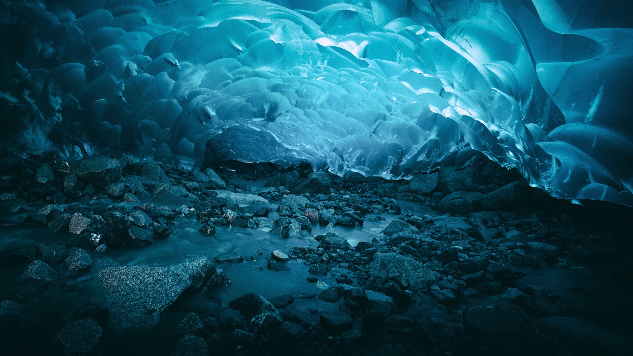 Mesmerizing ice caves, Dark underground world, Mystical blue glow, Captivating scenery, 2560x1440 HD Desktop