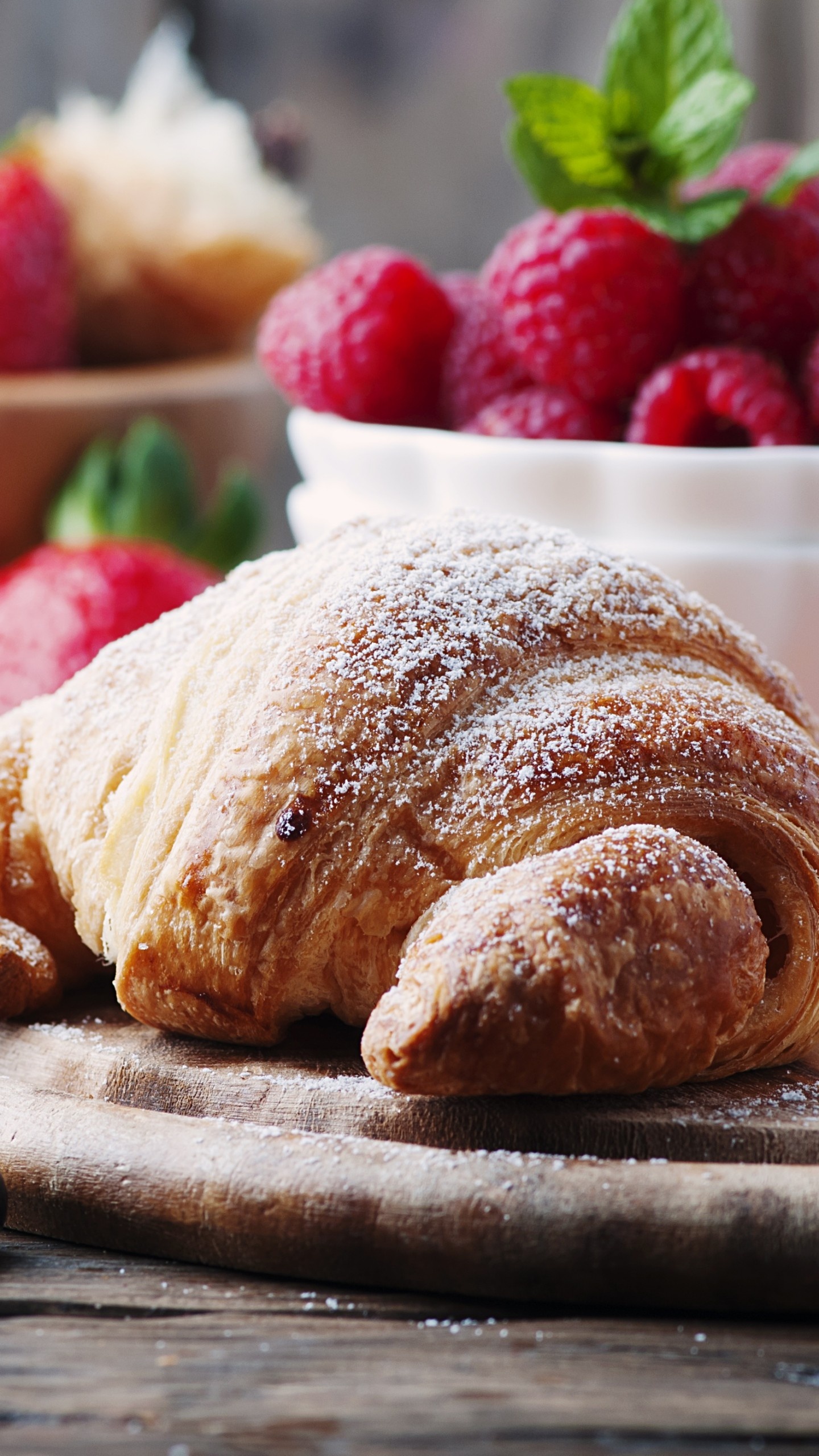 Croissant: A French pastry that is widely known for its crescent shape. 1440x2560 HD Background.