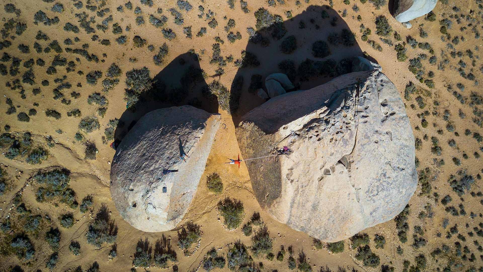 Slacklining: Highlining between the two giant rocks, Bishop, California. 1920x1080 Full HD Background.