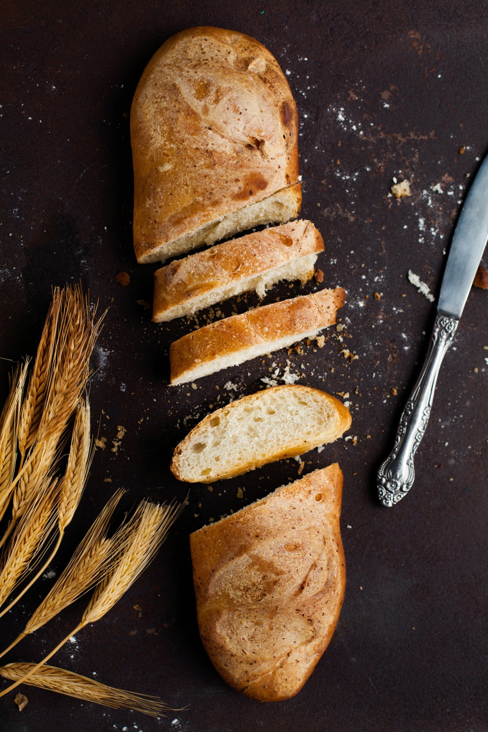 Baguette: A French bread, shaped like a long, thin loaf with a crisp and crunchy crust. 1710x2560 HD Wallpaper.