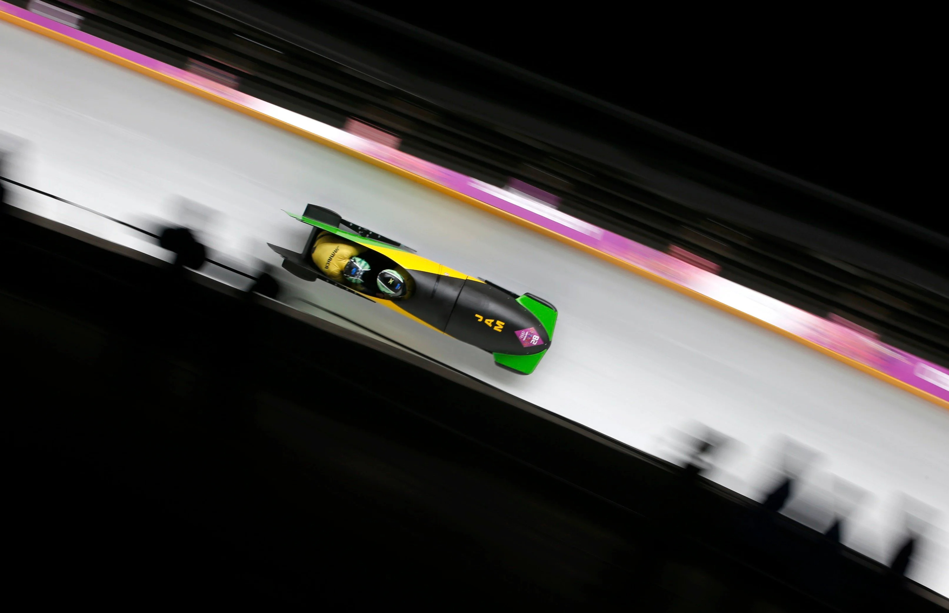 Bobsleigh: Jamaica's Winston Watts and Marvin Dixon speed down the track during the two-man event at the 2014 Sochi Winter Olympics. 3230x2090 HD Background.