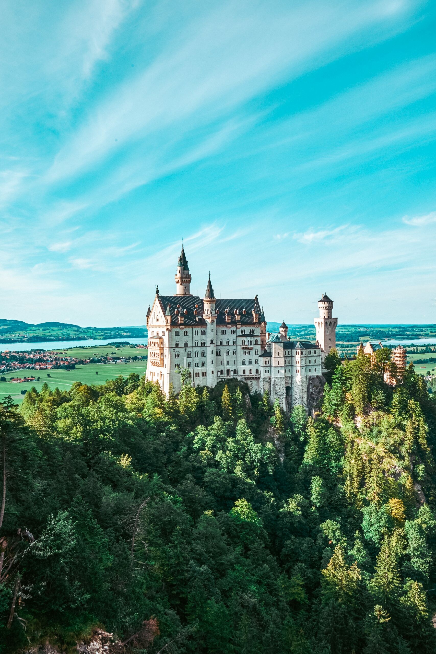 Neuschwanstein Castle: A part of UNESCO World Heritage, A fortified structure built during the Middle Ages. 1710x2560 HD Background.